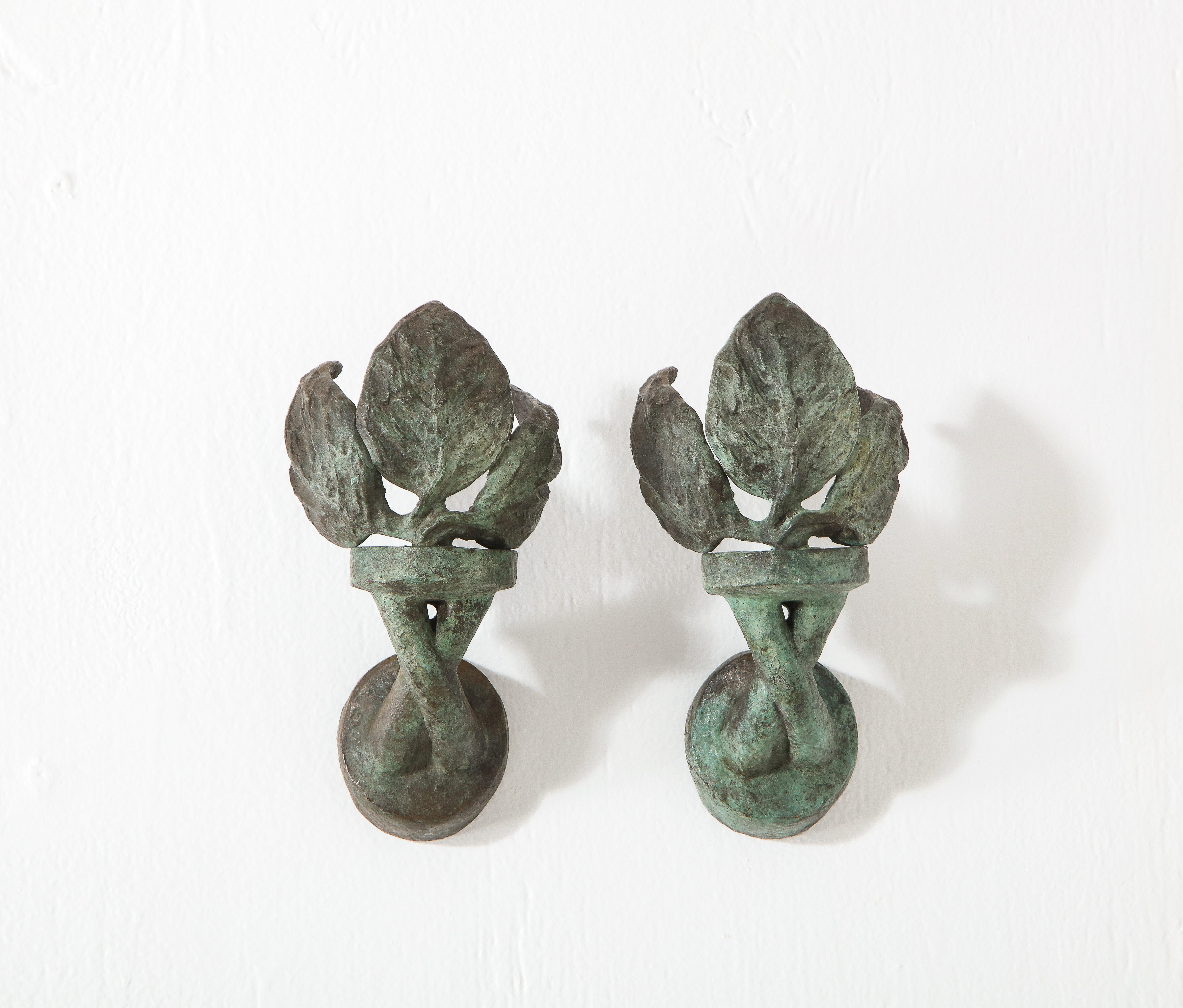 Exceptional pair of Philippe Anthonioz sconces in cast bronze with verdigris patina. Stamped with the foundry mark and the artist signature, this pair was authenticated by Mrs. Anthonioz.

Custom fabricated backplate included with purchase. Details