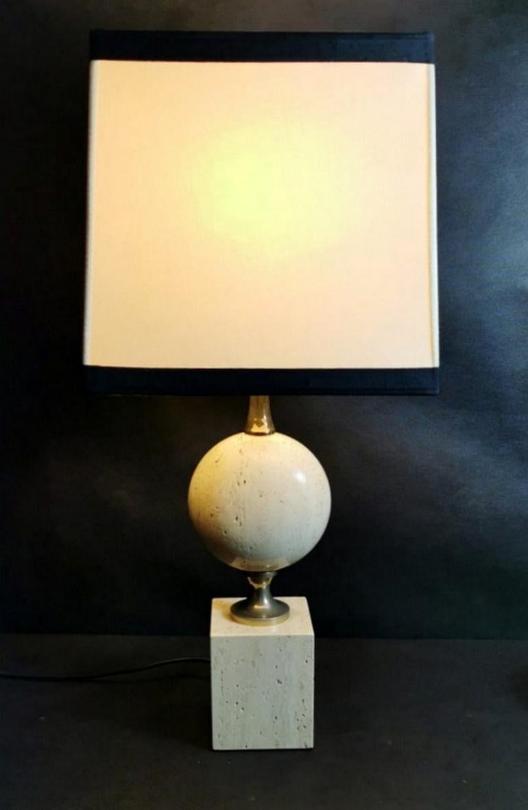 We kindly suggest you read the whole description, because with it we try to give you detailed technical and historical information to guarantee the authenticity of our objects.
Very elegant lamp in travertine; the base in the shape of a