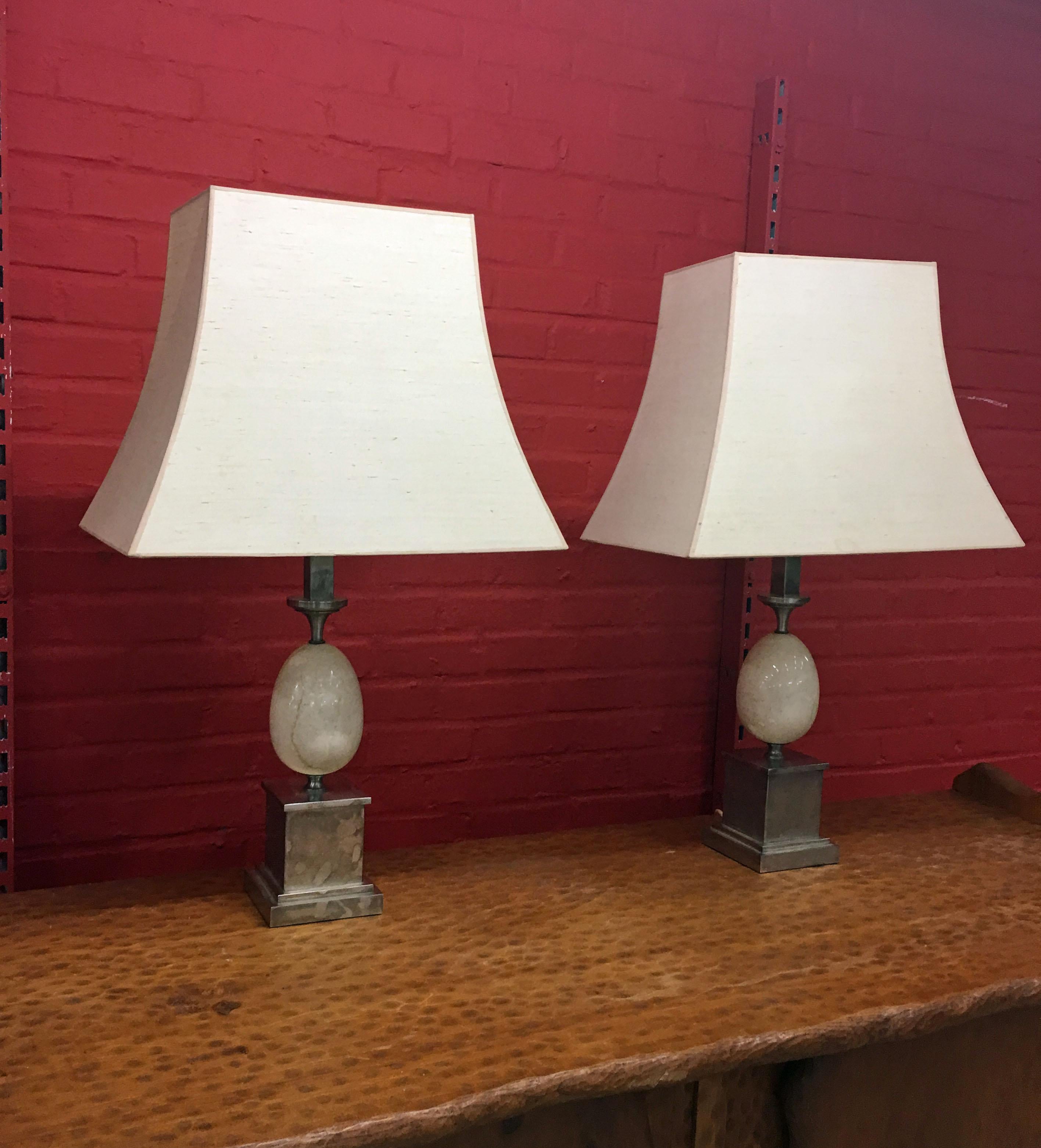 Philippe Barbier, pair of metal lamps nikele and travertine, circa 1960
original label.
Dimensions with shade: H 84 cm W 50 cm D 31 cm
Dimensions without shade: H 50 cm W 14 cm D 14 cm.