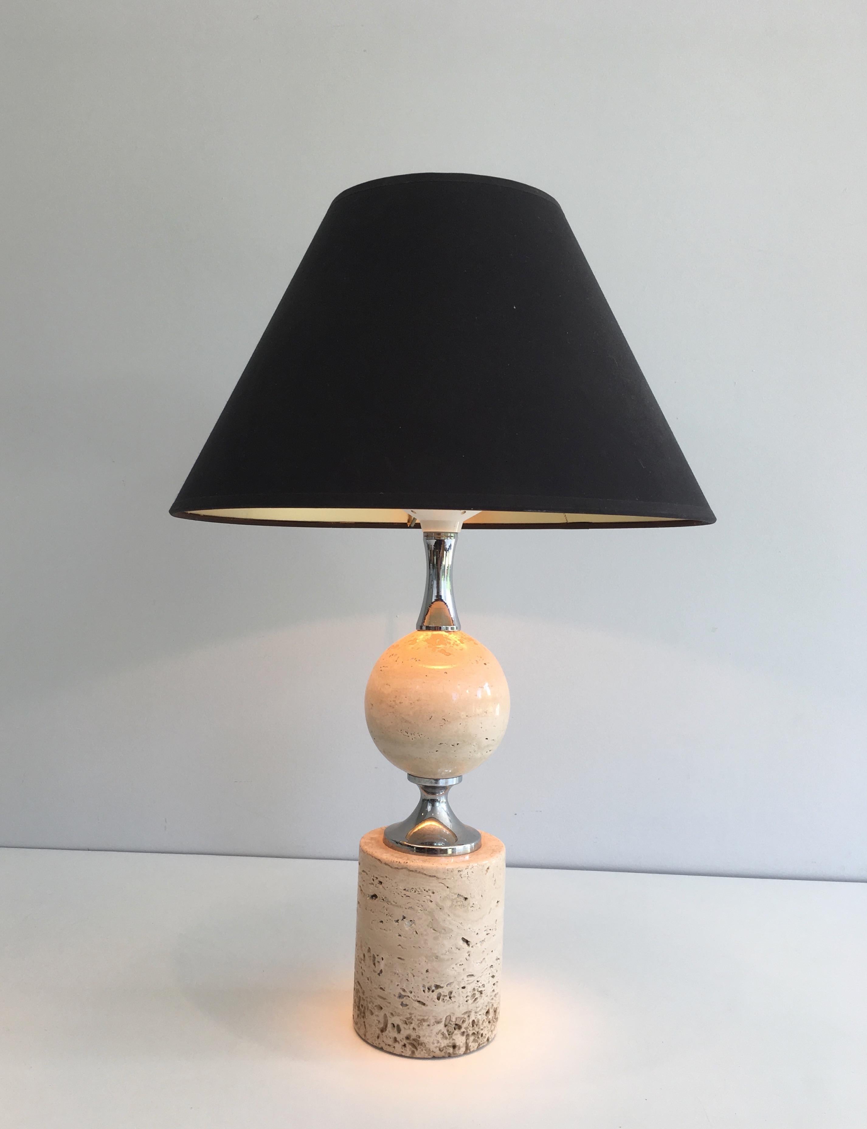 This nice table lamp is made of travertine and chrome. This is a work by famous French designer Philippe Barbier, circa 1970.