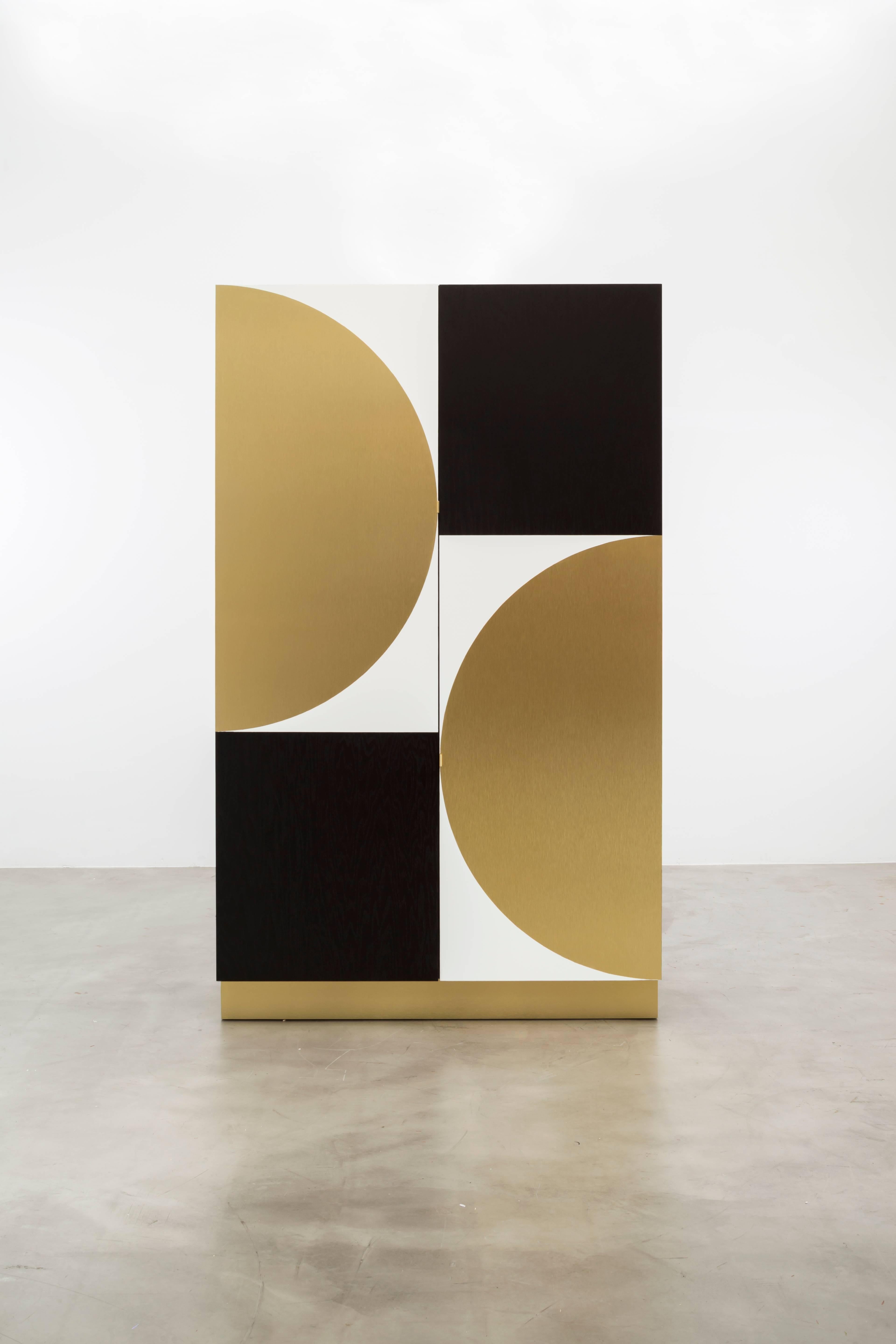 PHILIPPE CABINET - Modern Geometric Brass Inlay on an Oak and Acrylic Body.

The Philippe Storage Cabinet features a modern geometric brass inlay detail on a mixed oak and acrylic body. The interior is shown as a storage cabinet with six drawers,