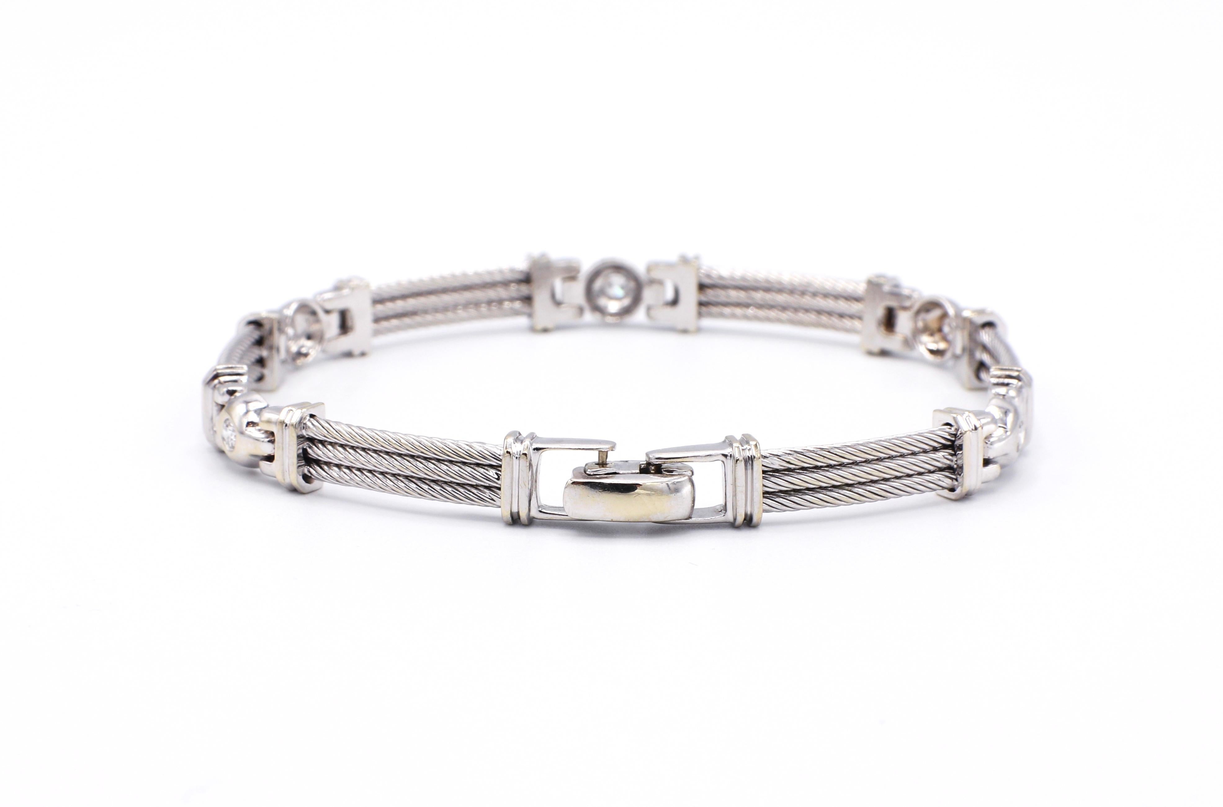 Philippe Charriol 18K White Gold .25 CTW Diamond & Steel Line Bracelet 

Metal: 18K white gold & Steel
Weight: 19.96 grams
Diamonds: Approx. 0.25 CTW G VS 
Length: 7.25 inches
Width: 6.5mm