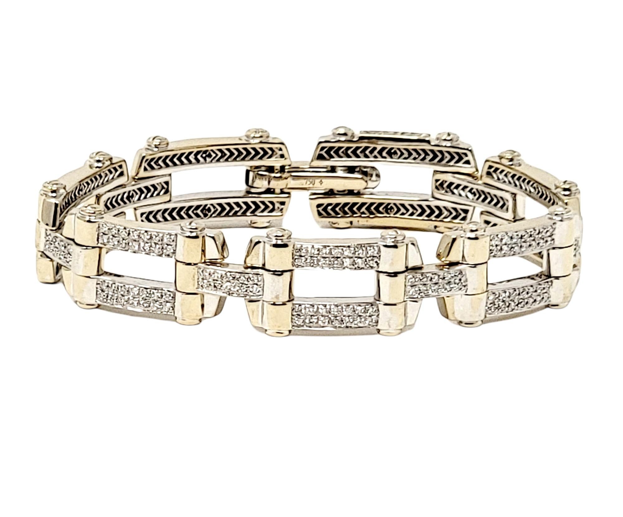 Gorgeous pave diamond and white gold link bracelet by designer Philippe Charriol. The sleek, contemporary design of this stunning piece paired with the brilliant white diamonds, really draws the viewers attention, making this a true statement piece.