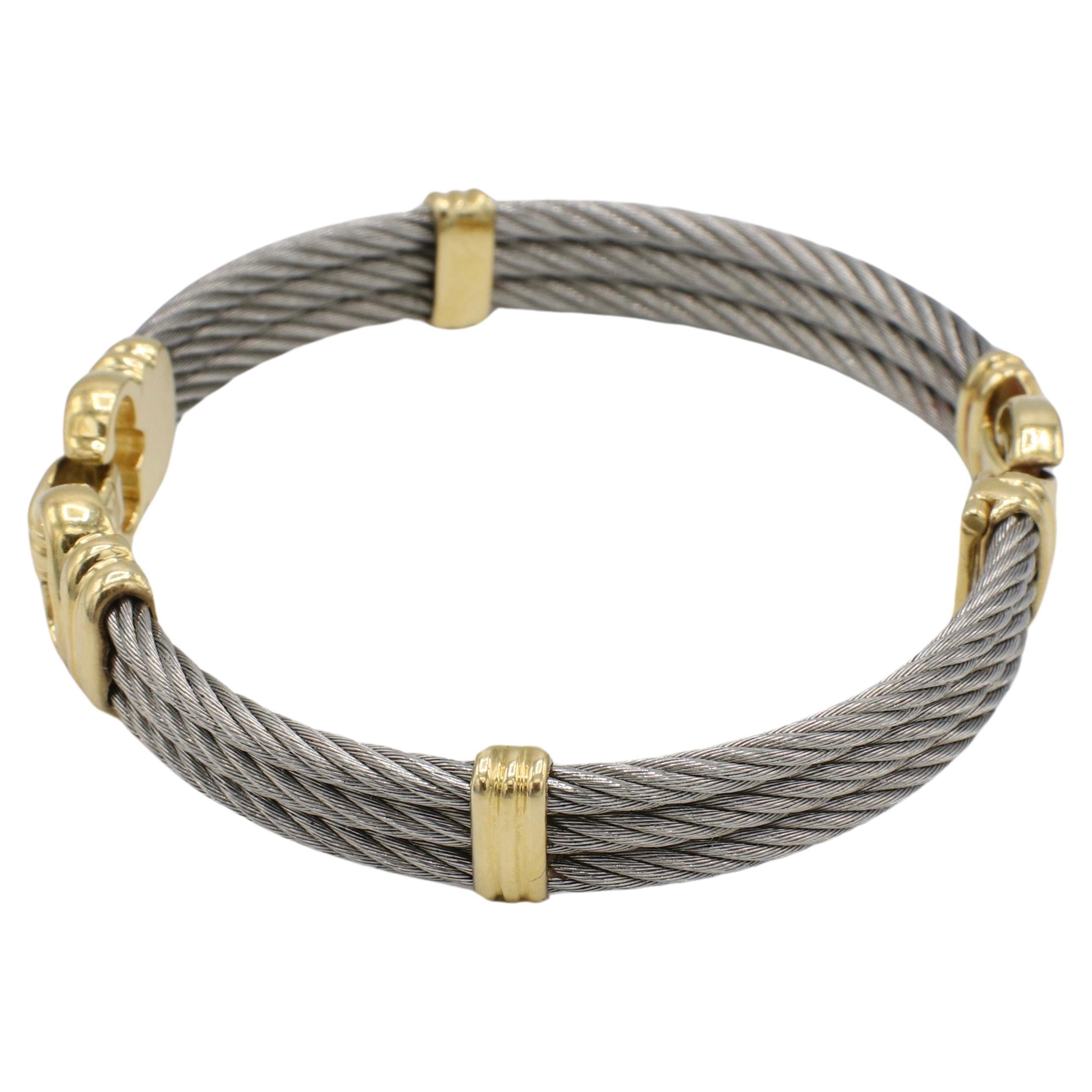 Philippe Charriol Steel & 18 Karat Yellow Gold Bracelet 
Metal: Stainless steel & 18k yellow gold
Weight: 35.9 grams
Circumference: 7.75 inches
Inside Diameter: 67mm
Width: 12mm
