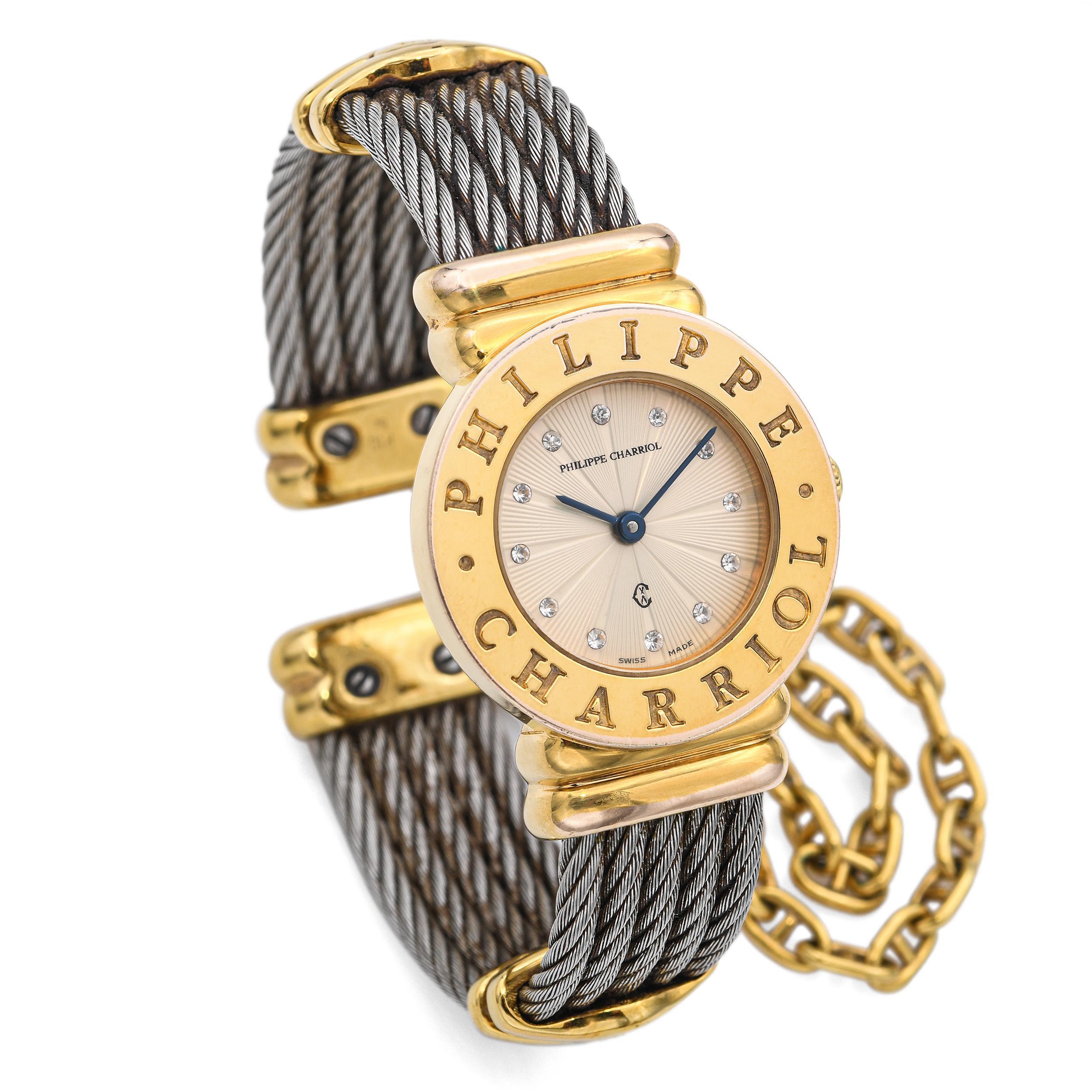 This vintage Philippe Charriol watch features the brand’s iconic twisted steel cable cuff design in a striking two-tone finish of stainless steel and 18k yellow gold plating. The round case is accented with sparkling diamonds, adding a touch of