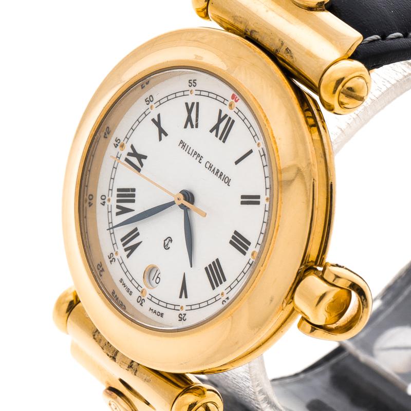 Wear luxury on your wrist by owning this wristwatch from Philippe Charriol. Swiss made, the watch has a metal case held by leather straps. On the white dial sits Roman numeral hour markers, Arabic numeral minute markers and a date window at the 6