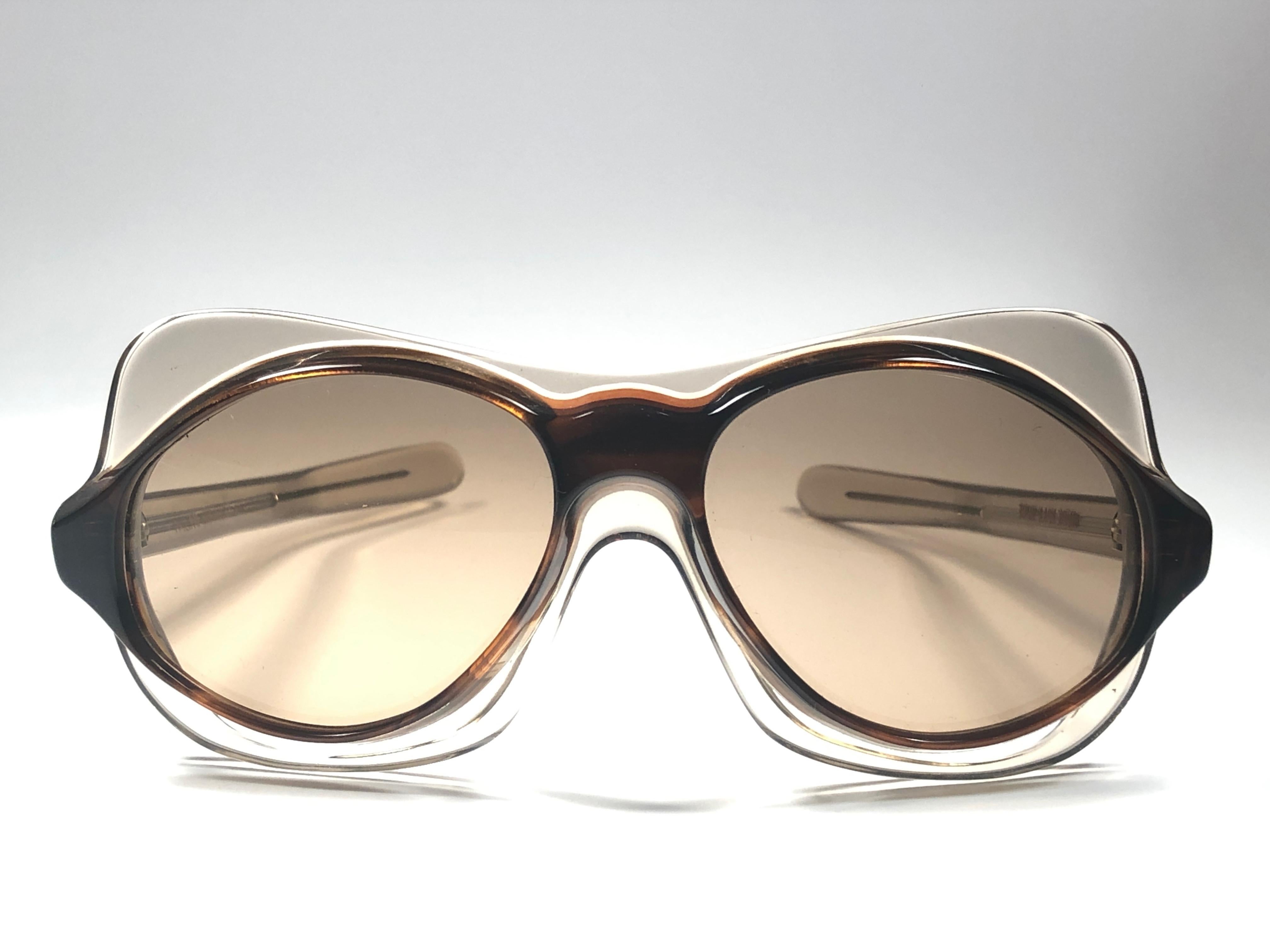 Rare collector's item vintage Philippe Chevalier translucent avant garde sunglasses with medium brown lenses.   

A superb find. 

Please notice this item show minor sign of wear consistent with age and storage.  

Made in France.