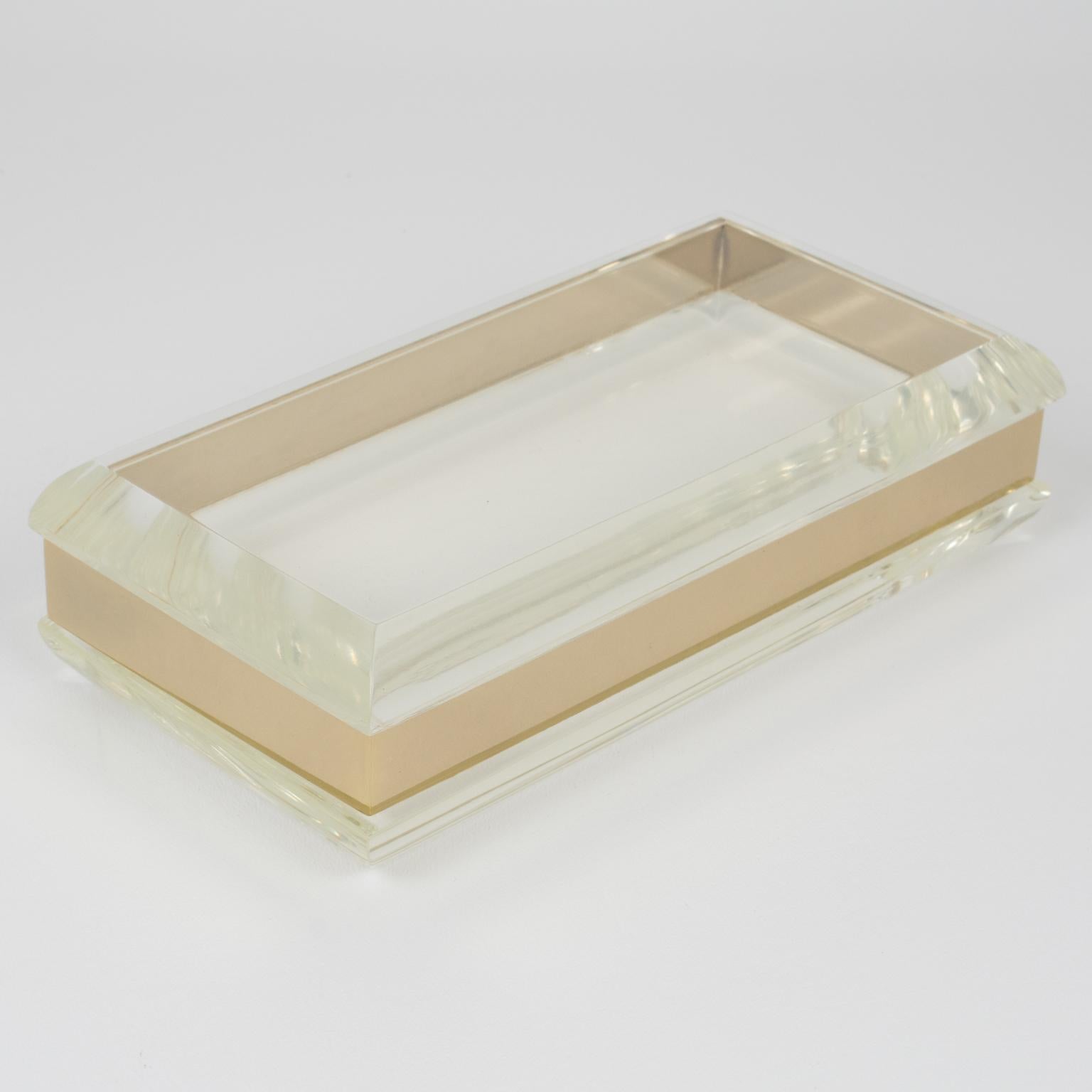 This stunning rectangular decorative lidded box has a design reminiscent of Philippe Cheverny's work. Crafted in the 1970s, the lovely decorative piece boasts a geometric shape with an extra-thick transparent Lucite slab for the base and the lid.