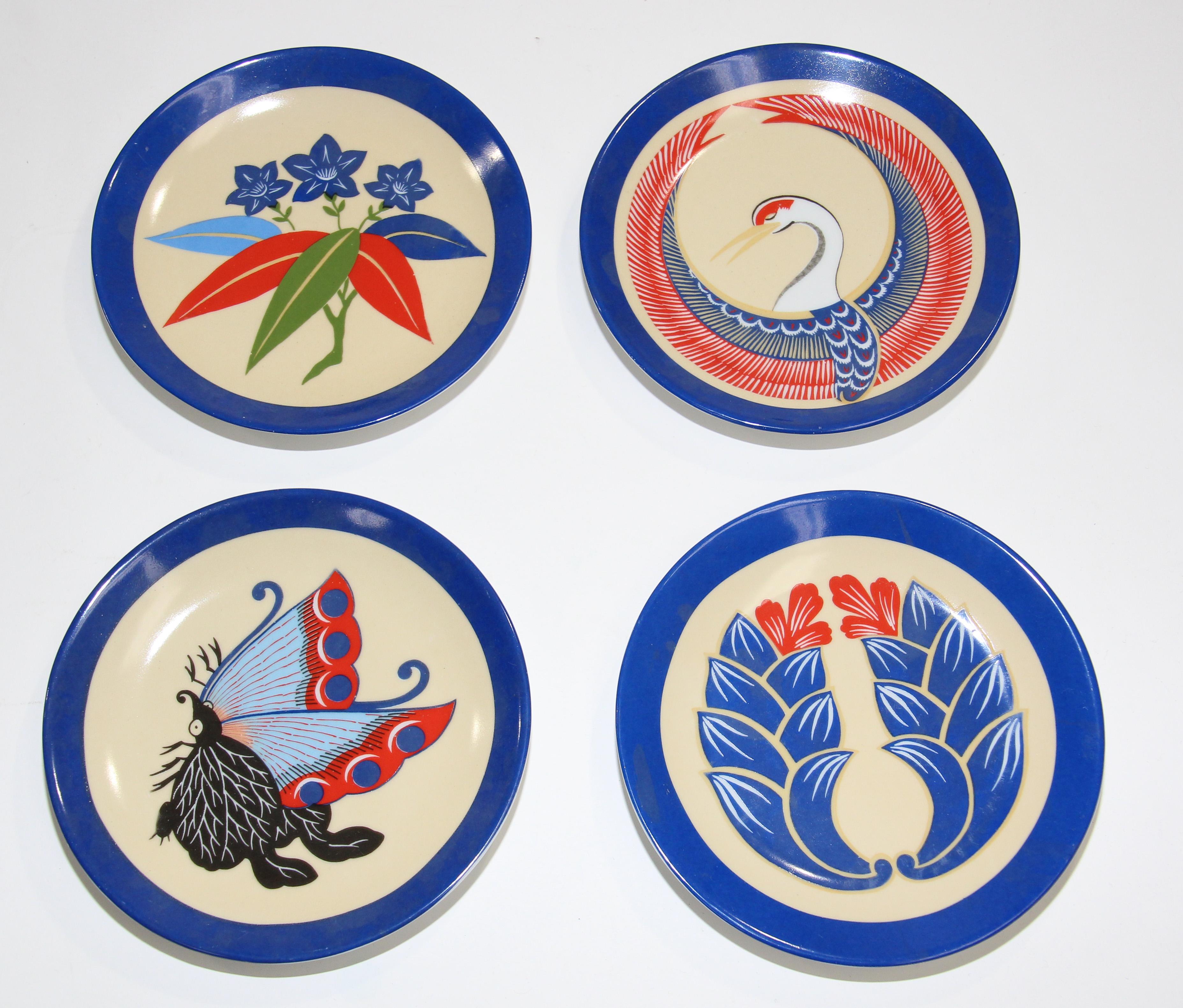 Set of four Japanese Art plates recreated by Philippe Deshoulieres, Lourioux, France for the Museum of Fine Arts- Boston. 
Philippe Deshoulieres Lourioux Limoges Plates Boston MFA Japanese No Theatre Design.
The plates are adaptations from 18th