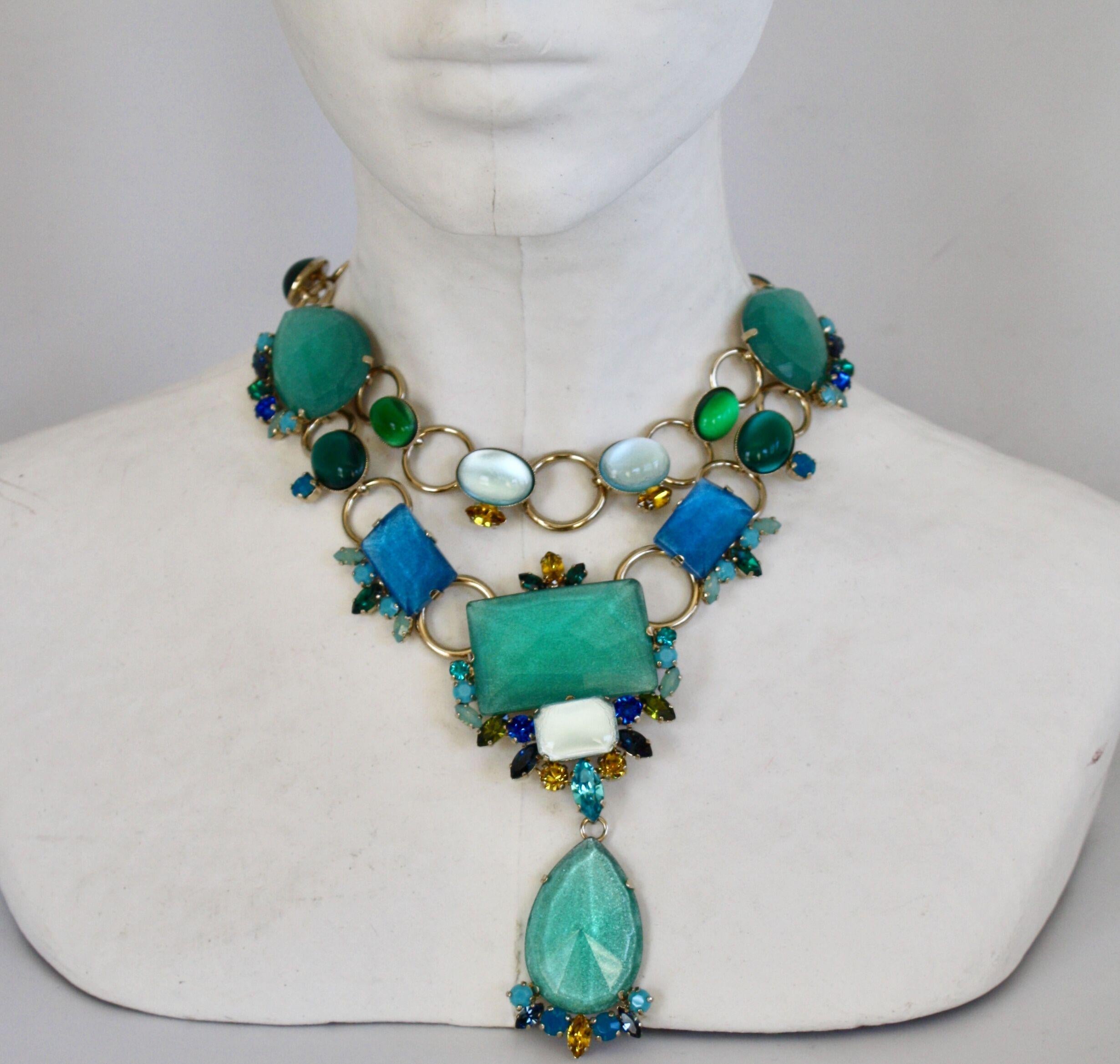 Statement necklace made from Swarovski Crystals and glass in shades of blue, aqua, and white. 

Drop is 4