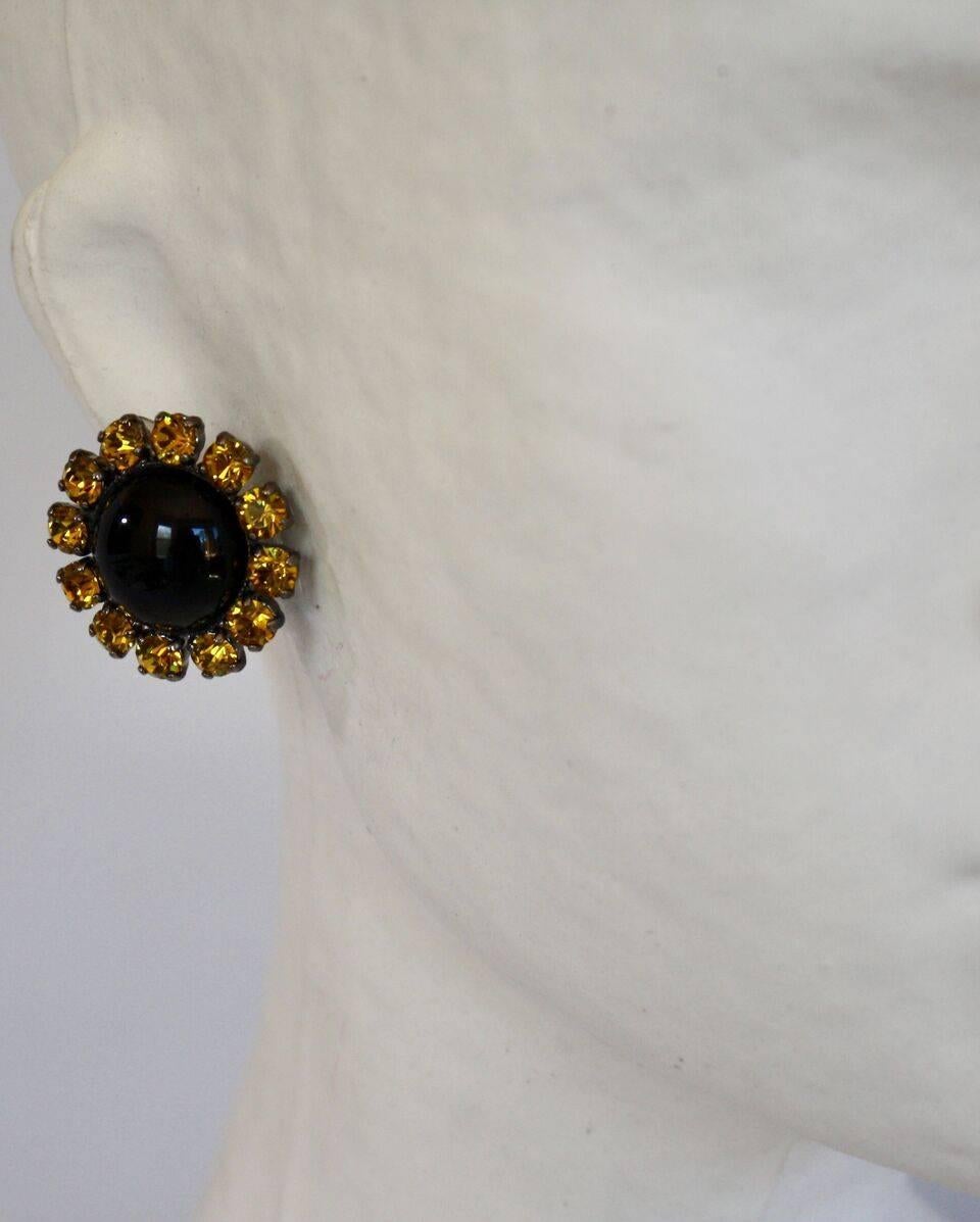 Glass cabochon and Swarovski crystal button clip earrings from Philippe Ferrandis. 