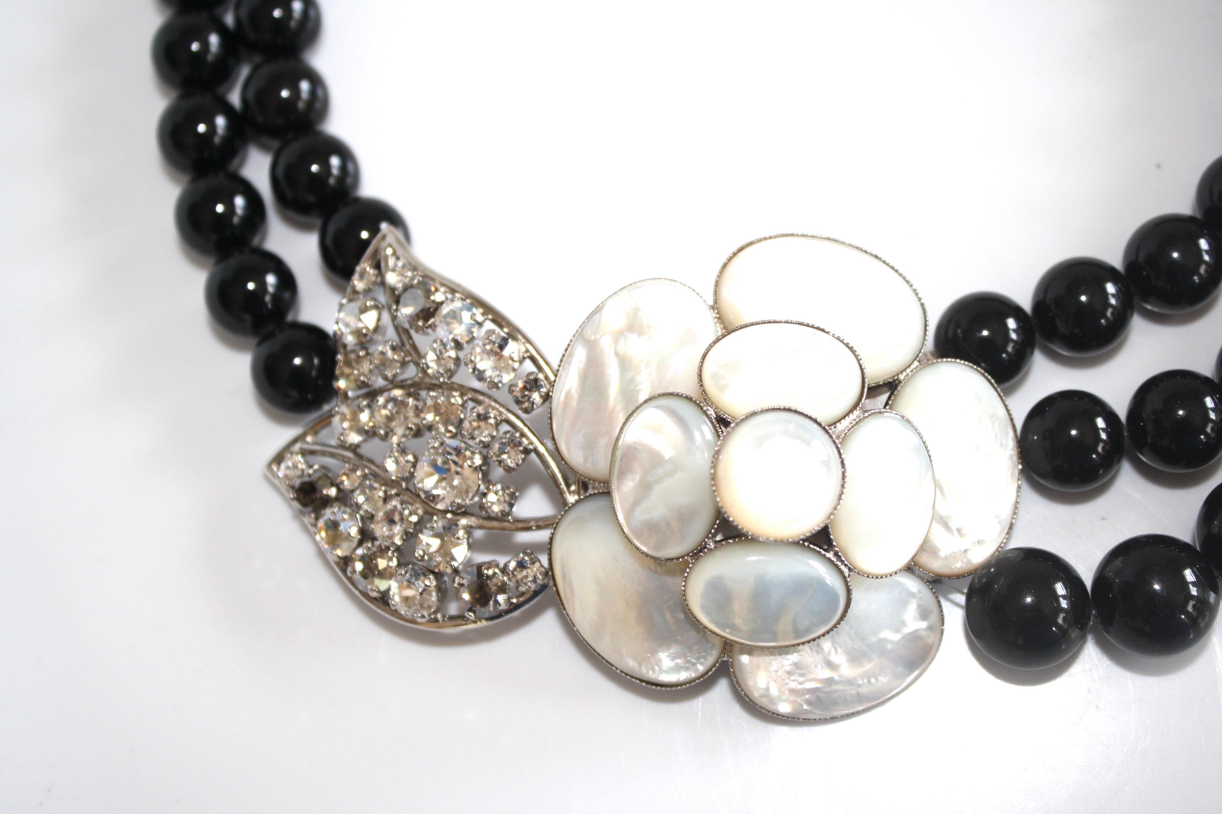 Glass pearl and mother of pearl necklace from Philippe Ferrandis. 