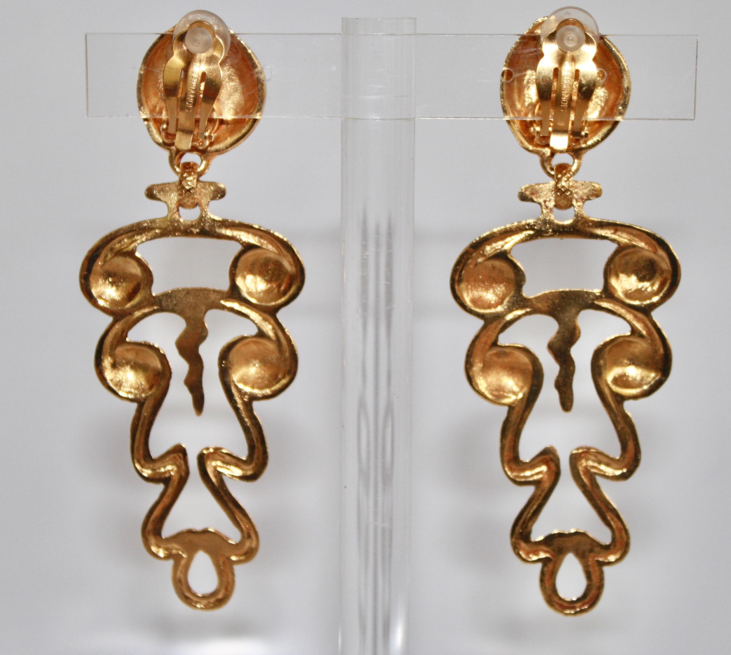 Unexpected and new gold clip earrings in a Grecian style from Philippe Ferrandis. 