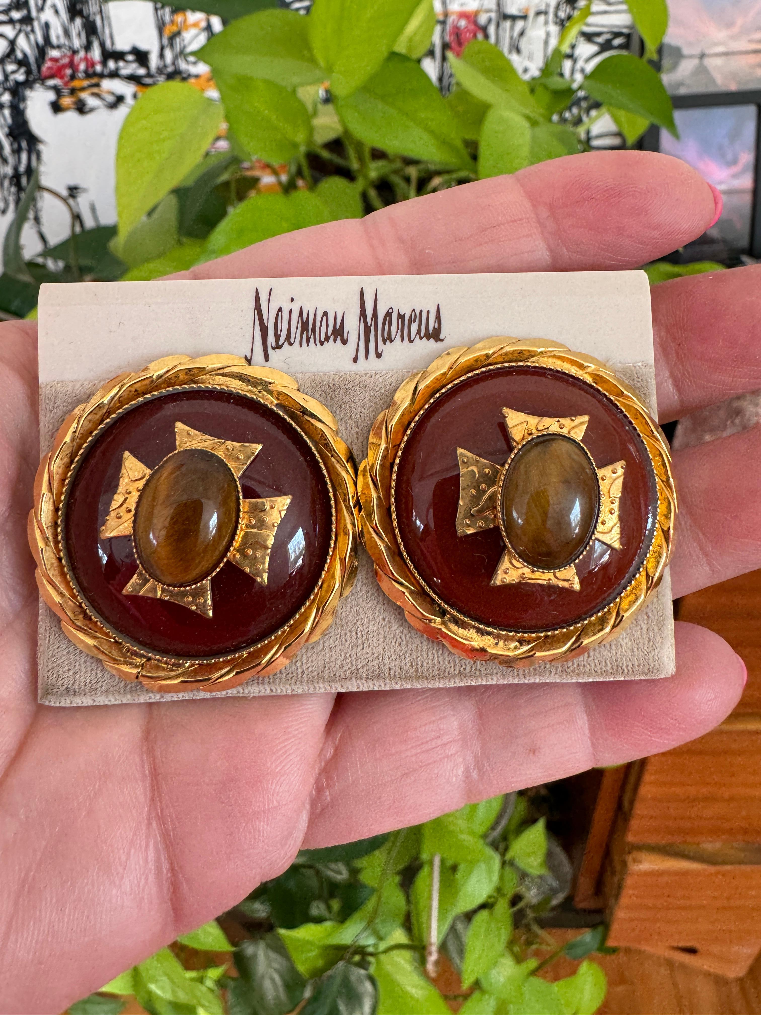 New Old Stock, never worn Phillipe Ferrandis Maltese Cross Clip on- Made in France. Bezel Set Tiger Eye Center with Gold gilt overlaid Cross then encased in a twisted Gilt gold. They are 1.50 in diameter. Still on the Neiman Marcus earring Card