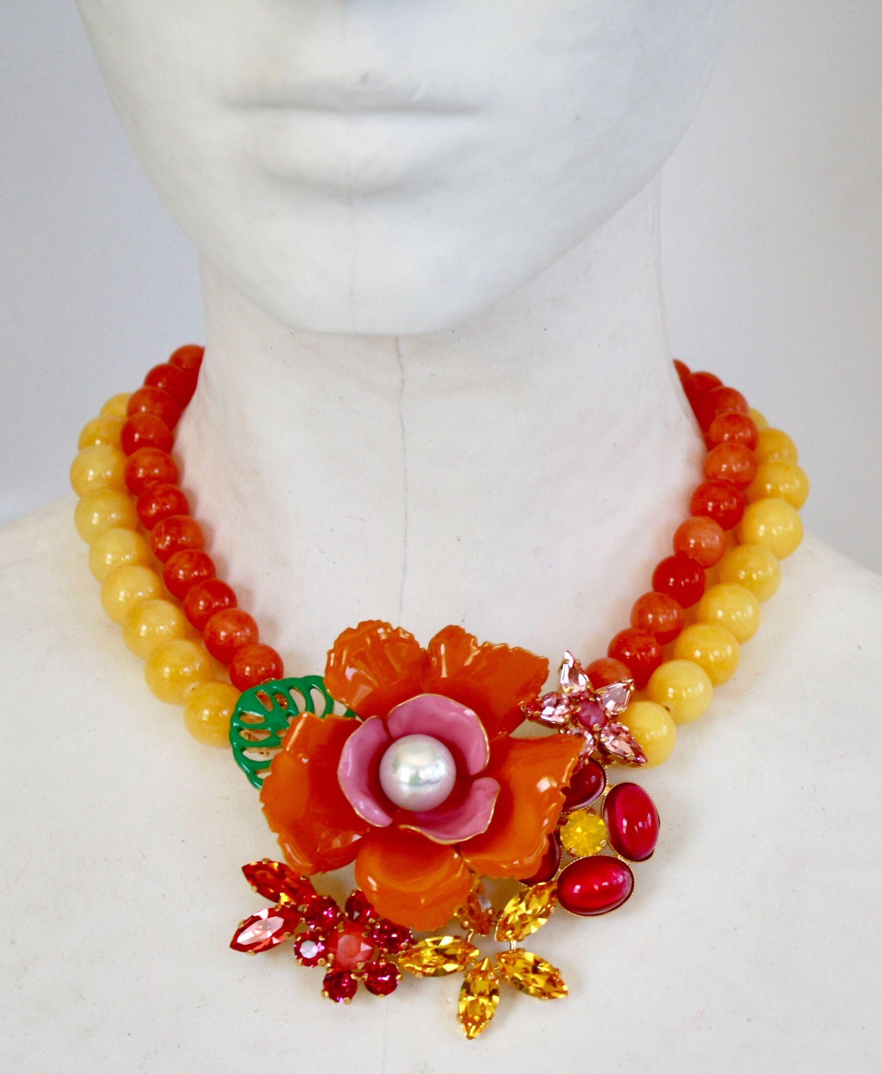 Handmade glass bead necklace with enamel and Swarovski Crystal flowers from Philippe Ferrandis.

Flower pendant is 3