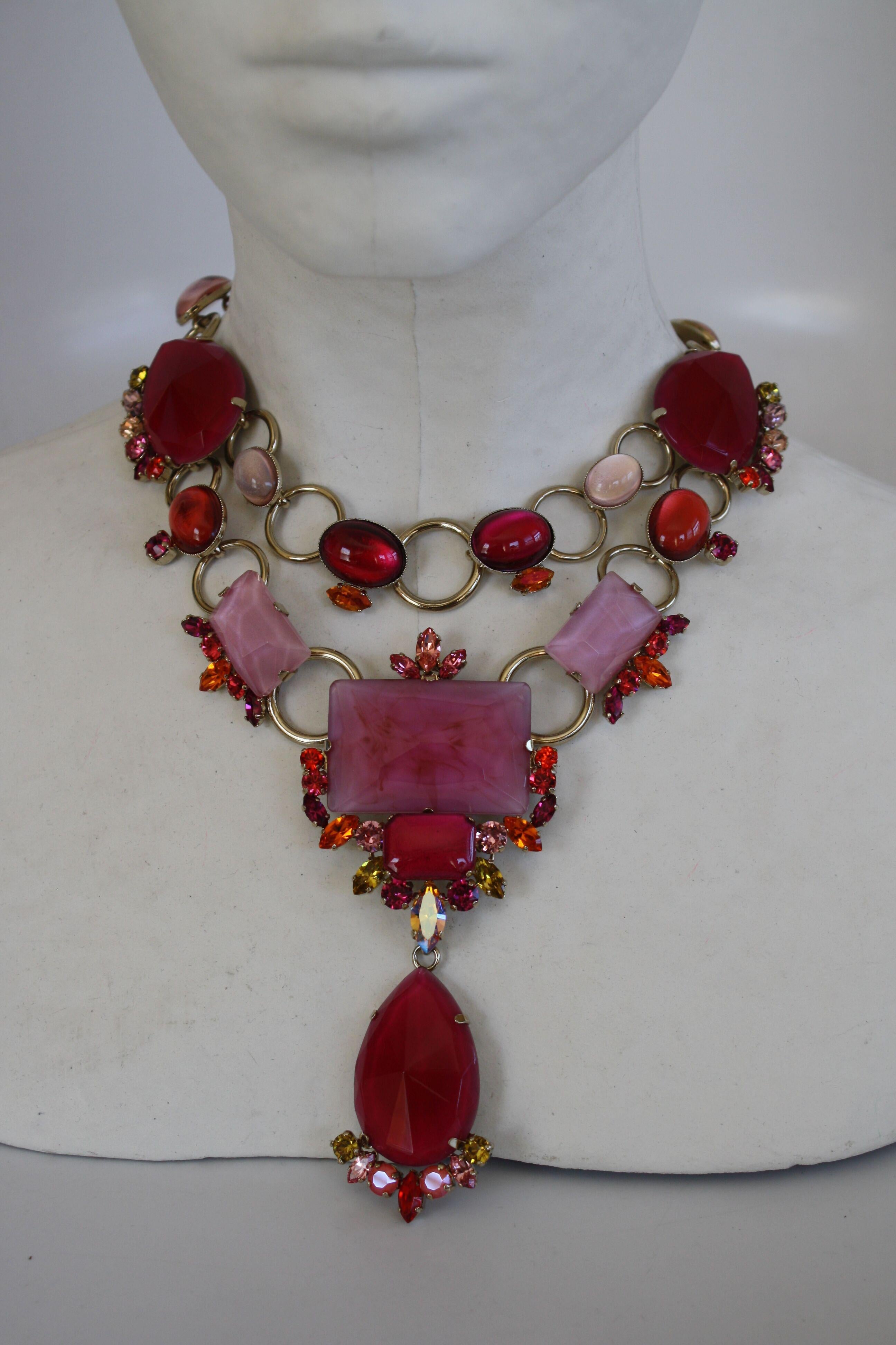 Statement necklace made from Swarovski Crystals and glass in shades of pink and fuchsia. Drop is 4