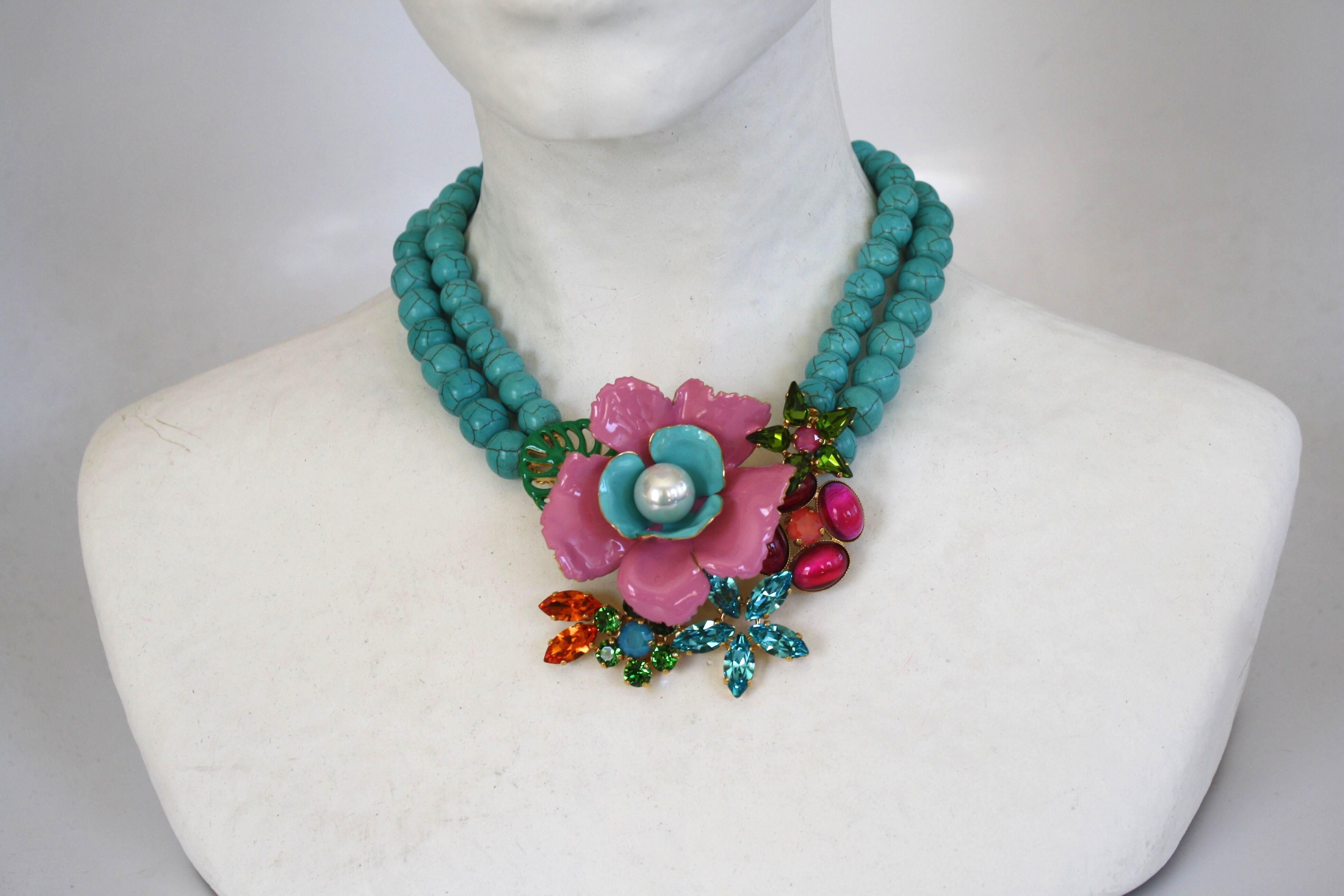 Turquoise bead necklace with enamel and Swarovski Crystal flowers from Philippe Ferrandis.

