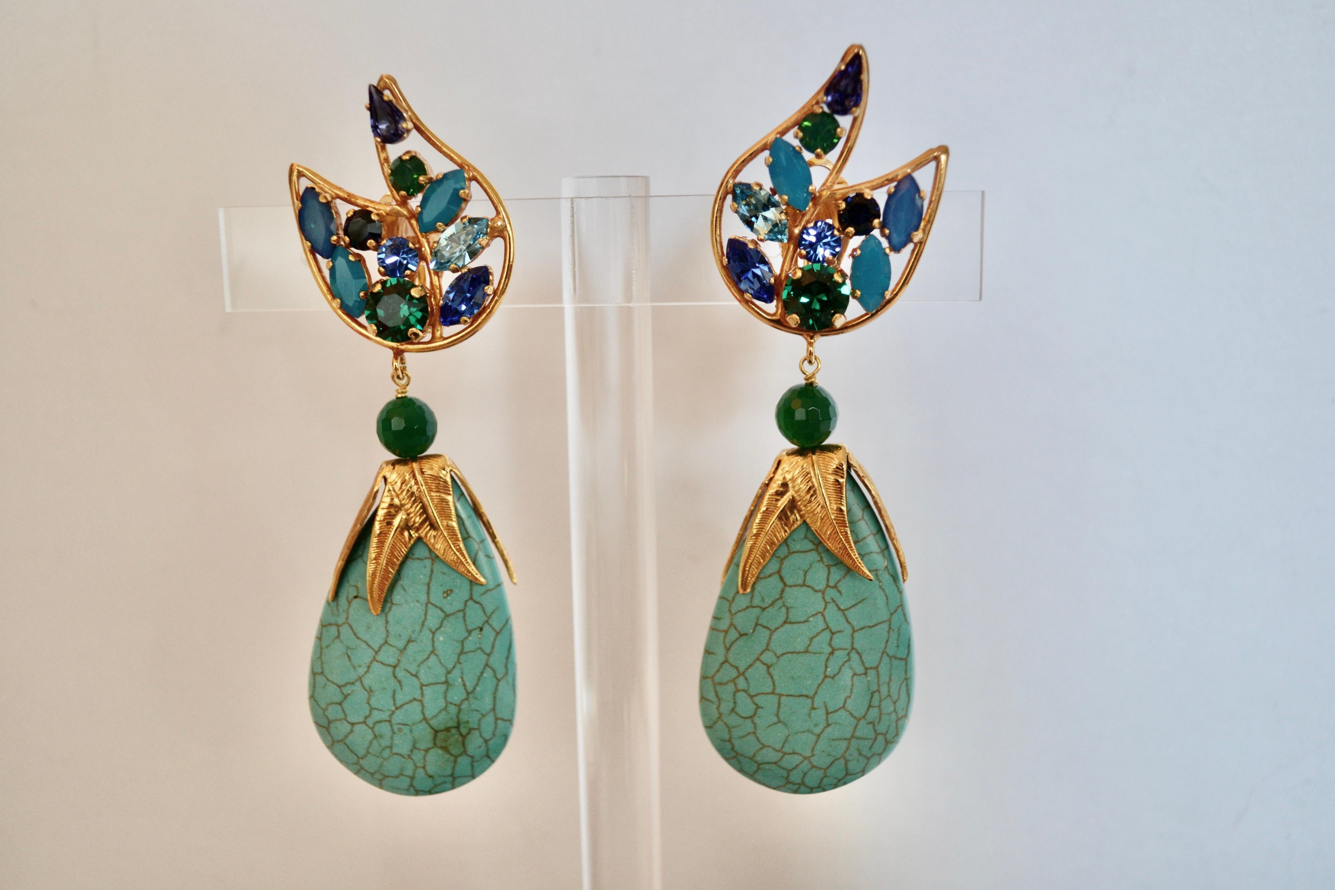 Clip earrings with Swarovski Crystal in wing design. Turquoise drop set on gold metal.
From the limited 