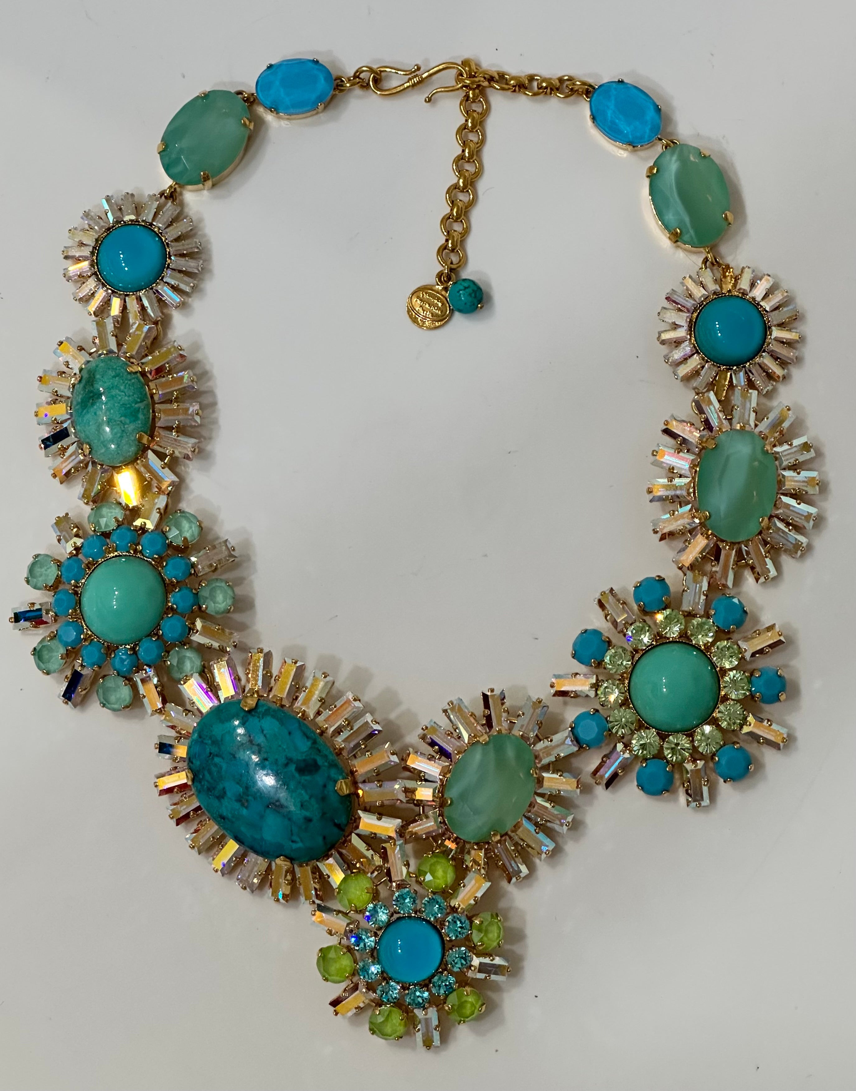 Exclusively made for Isabelle K Jewelry. This stunning one of a kind necklace has turquoise, green agate, pate de verre cabochons and Swarovski crystals in different shapes and colors . This is a timeless piece.
Made in France
Philippe Ferrandis,