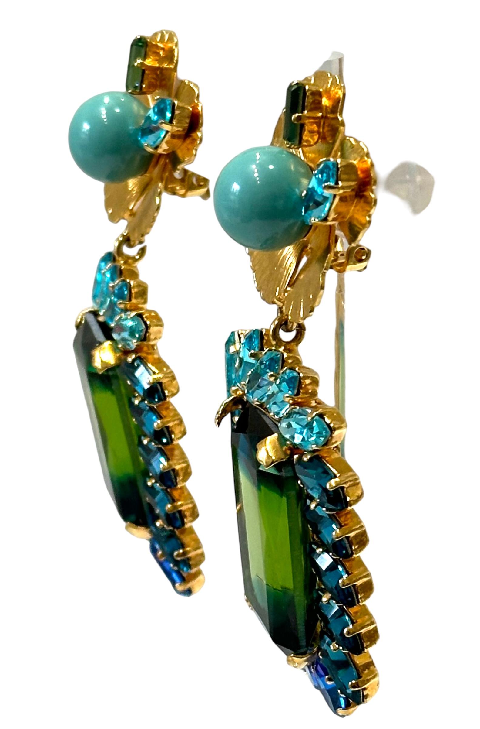 One of a kind made exclusively for Isabelle K Jewelry.
24carat gilded brass, Swarovski Crystal in exquisite colors . Turquoise glass pearl.
A show stopper!
Philippe Ferrandis was just chosen by the iconic French perfume company Guerlain for a