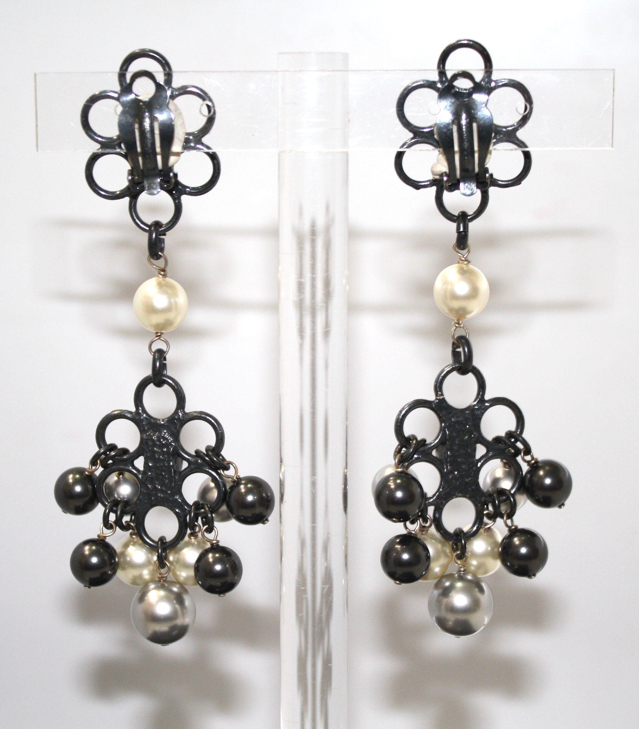 Dark rhodium with Swarovski crystals and handmade glass pearls.