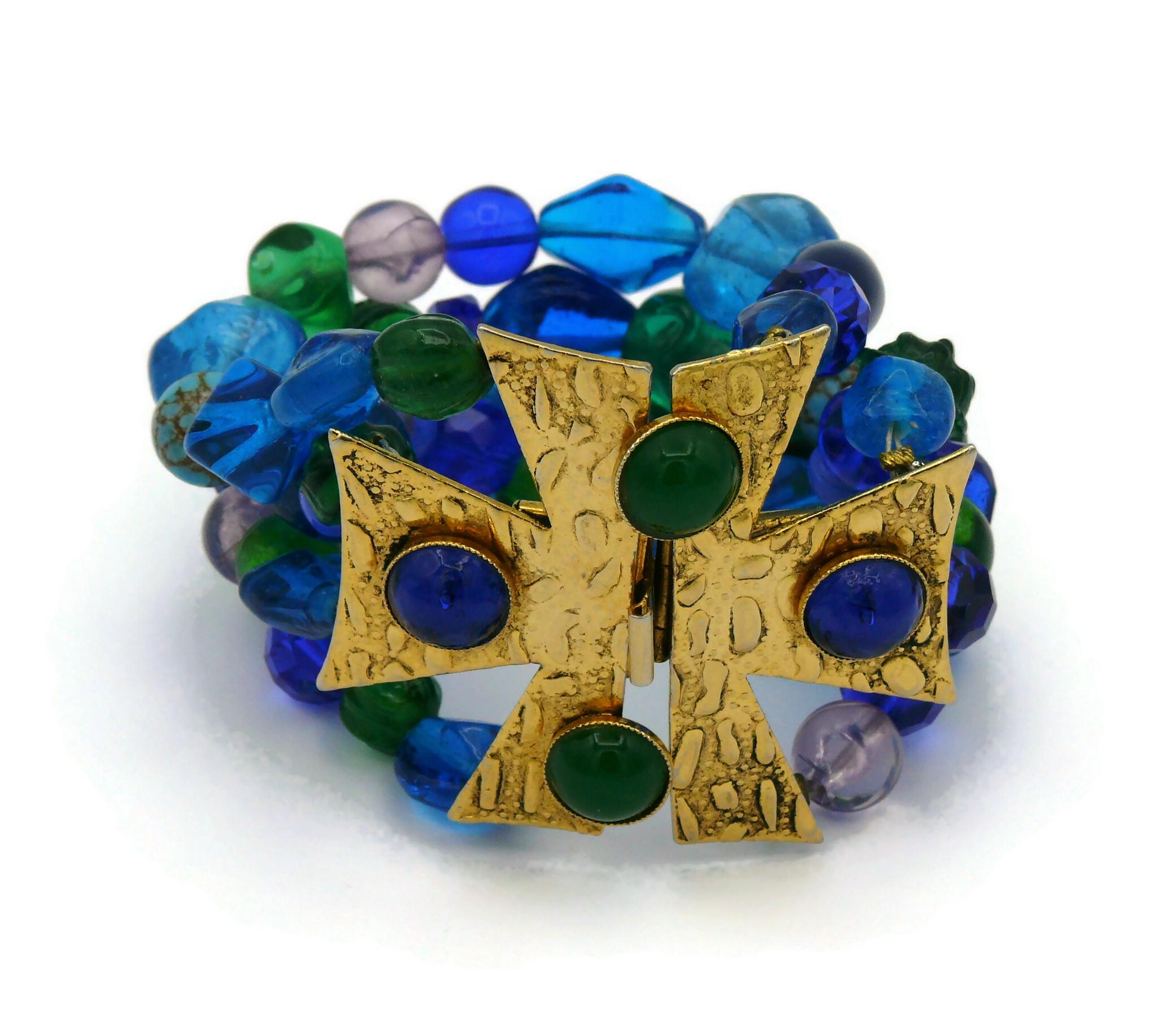 PHILLIPE FERRANDIS vintage textured gold tone Maltese cross cuff bracelet featuring multicolor glass and resin beads.

Push clasp closure.

Marked PHILIPPE FERRANDIS Paris.

Indicative measurements : length approx. 18.5 cm (7.28 inches) / width