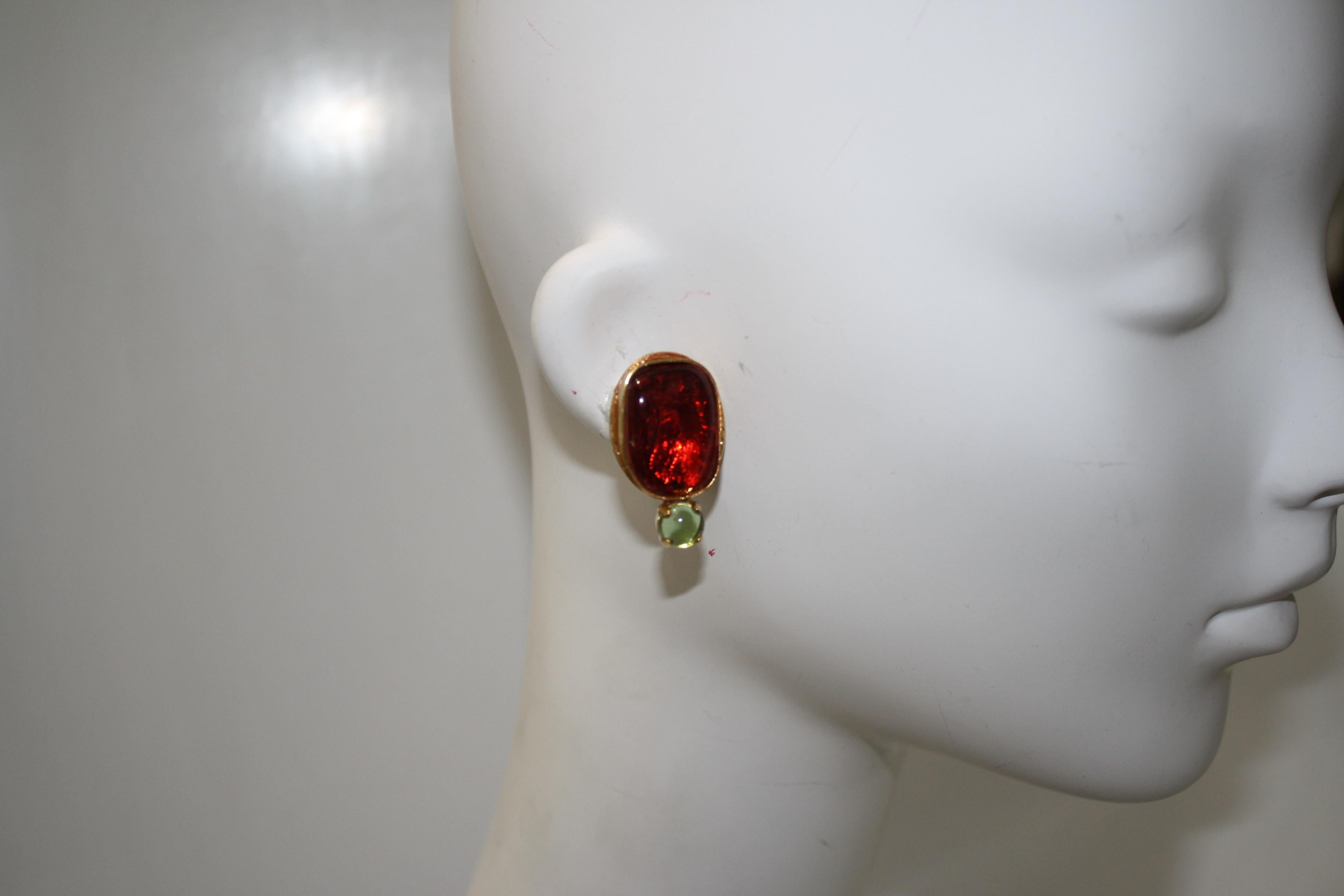 From Philippe Ferrandis spring collection Vitrail, these earrings are made in the poured glass process made famous by the House of GRIPOIX. Deep red glass poured into a beautiful setting in 24-carat gold dipped brass. Signature on the back of the