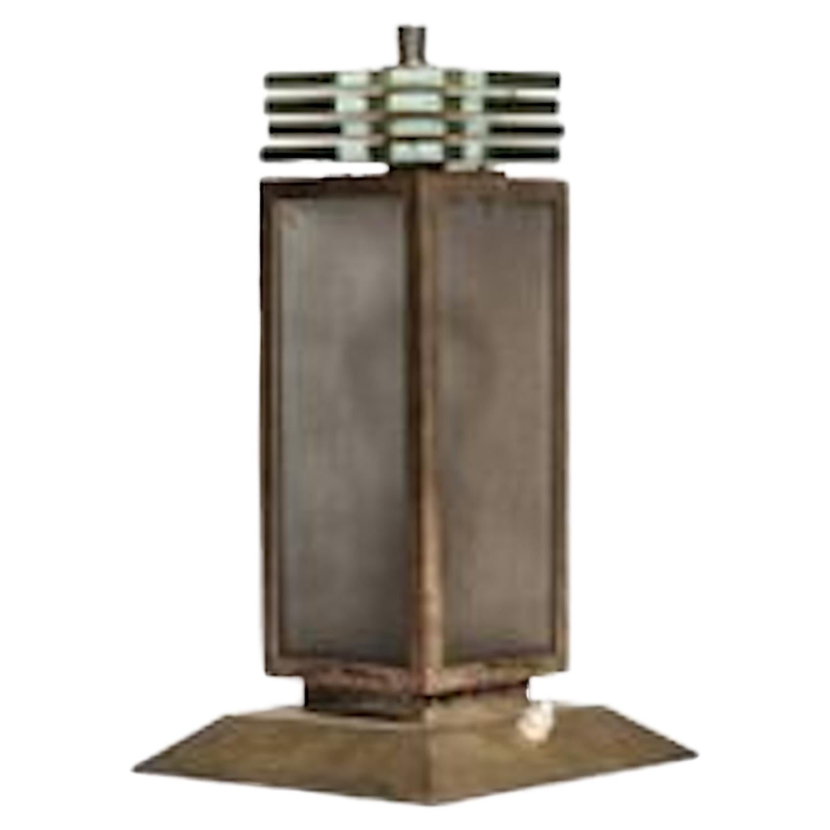  A Modernist nickel metal lamp by Philippe Genêt and Lucien Michon with four sandblasted glass plates at the top and the shaft surmounted by four glass plates. Stamped 