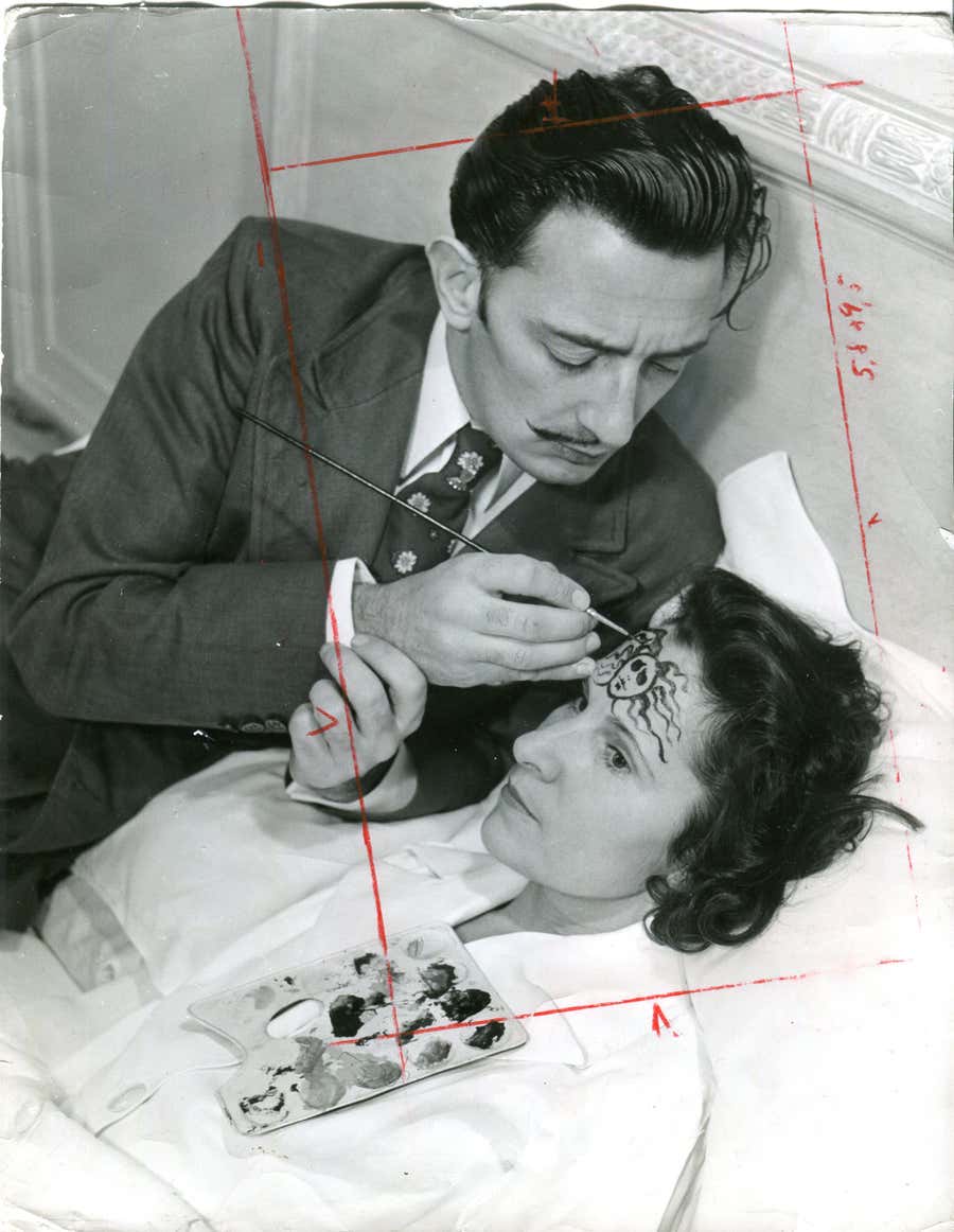 Dali is painting medusas head on Galas forehead