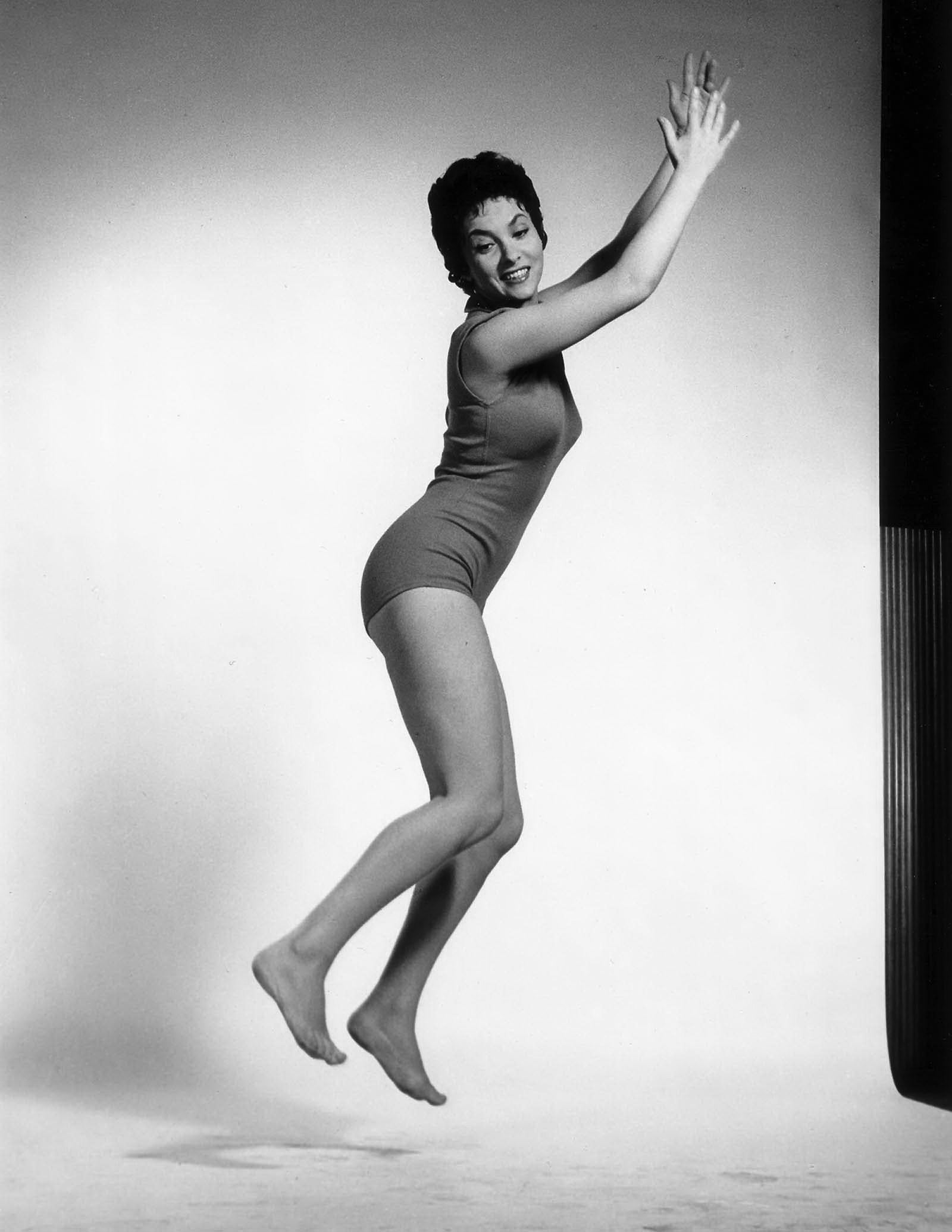 Philippe Halsman Black and White Photograph - Gina Lollobrigida Jumping, Black and White Vintage Photograph of Hollywood 1950s