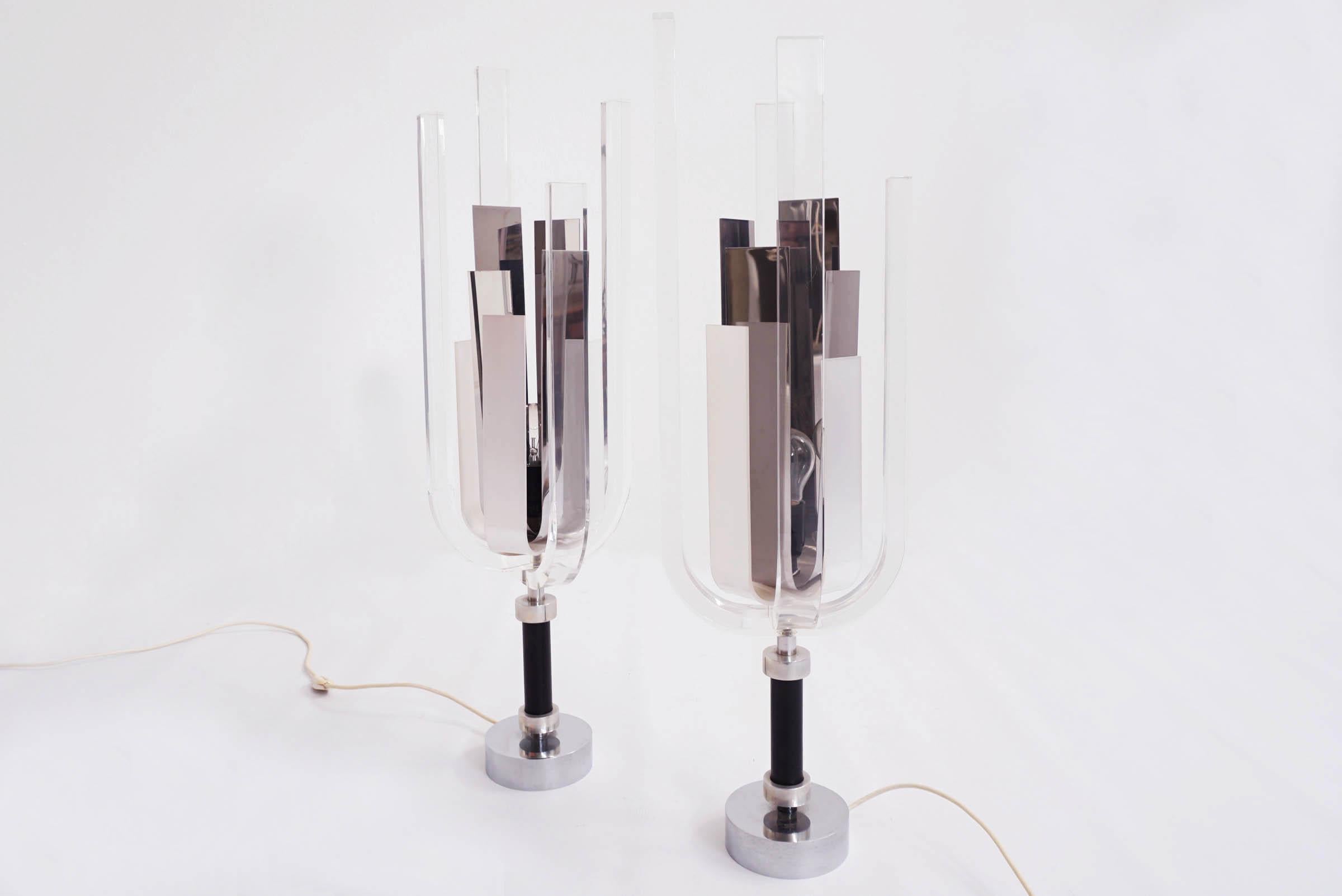 Sparkling lamps in curved plexiglass, mirror polished steel, black leather. Truly unique and luxurious objects.