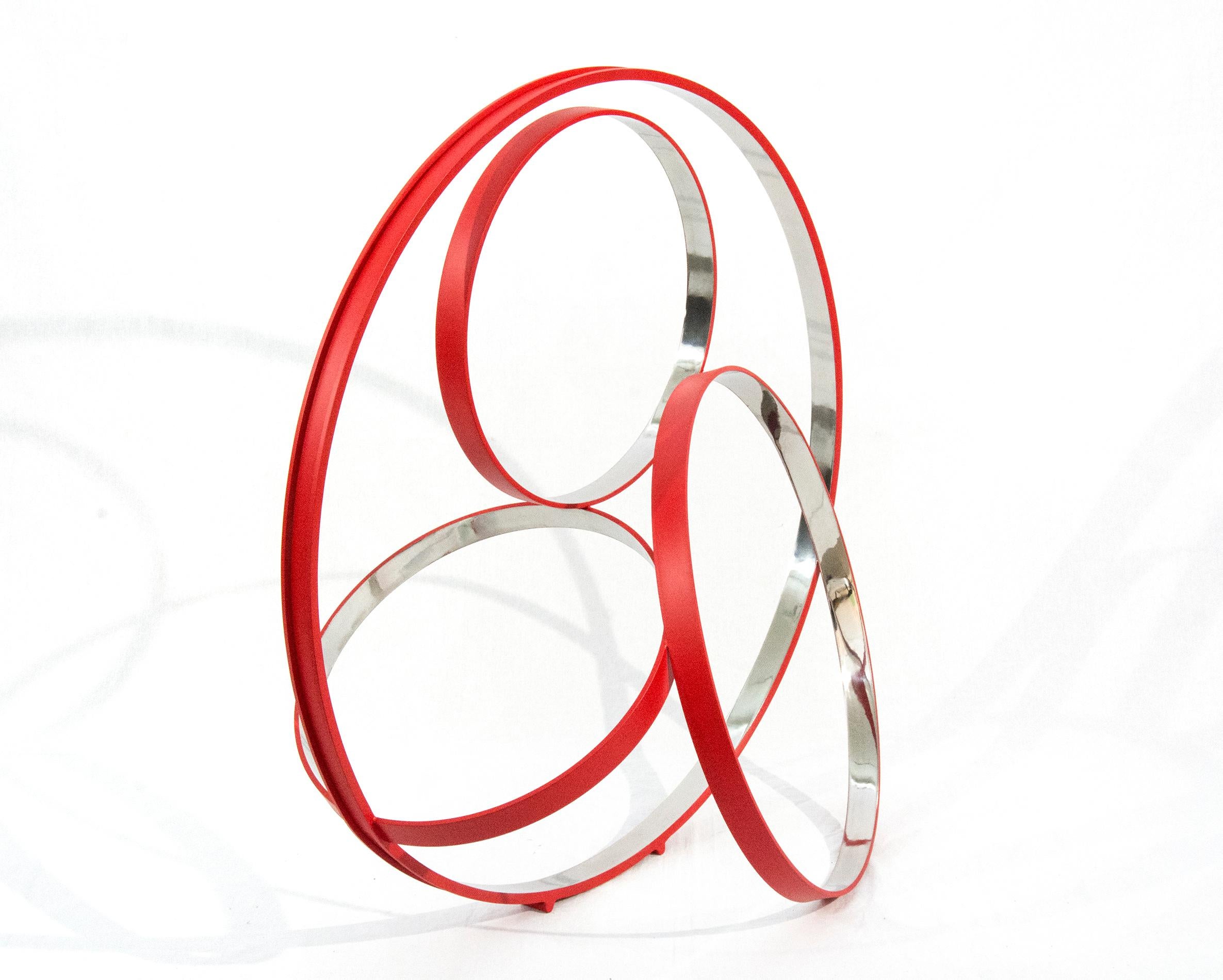 Large floor or tabletop sculpture. comprised of four stainless steel rings, polished on the inside and matte red on the exterior. This work is number 2 in an edition of 10, available by commission. Please allow 4-6 weeks for delivery.

Philippe
