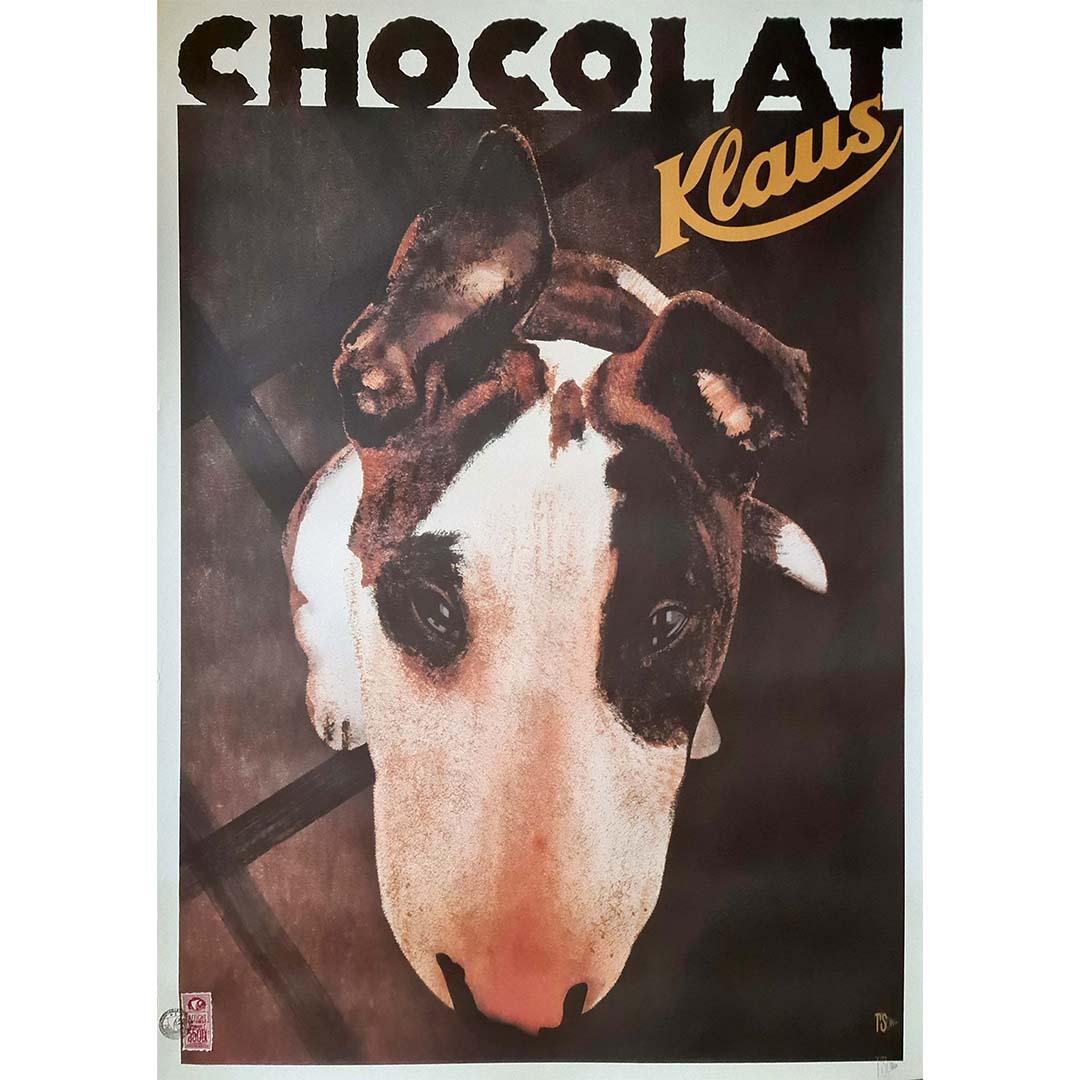 The circa 1990 original advertising poster by Philippe Sommer for Chocolat Klaus presents a delectable invitation into the world of fine chocolate. Crafted with meticulous attention to detail, this poster is a testament to the artistry and quality