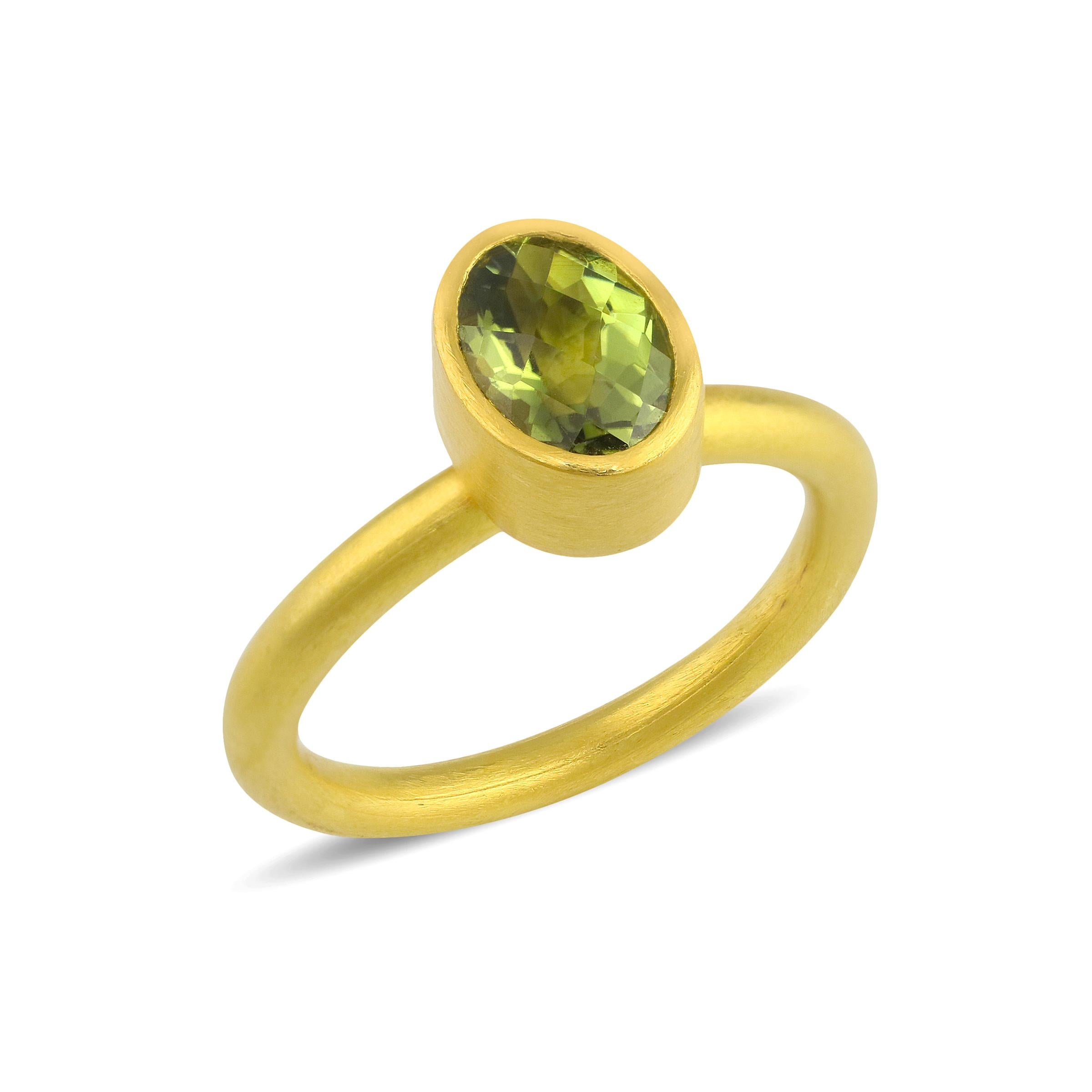 PHILIPPE-SPENCER -   1.3 Ct. Faceted Oval Green Tourmaline wrapped in 22K Gold Bezel with Solid Round 20K Gold Ring. Brushed Matte Finish. Size 6 3/4, and is in-stock and ready to ship. Our apologies in advance, this One-Of-A-Kind Solitaire is not