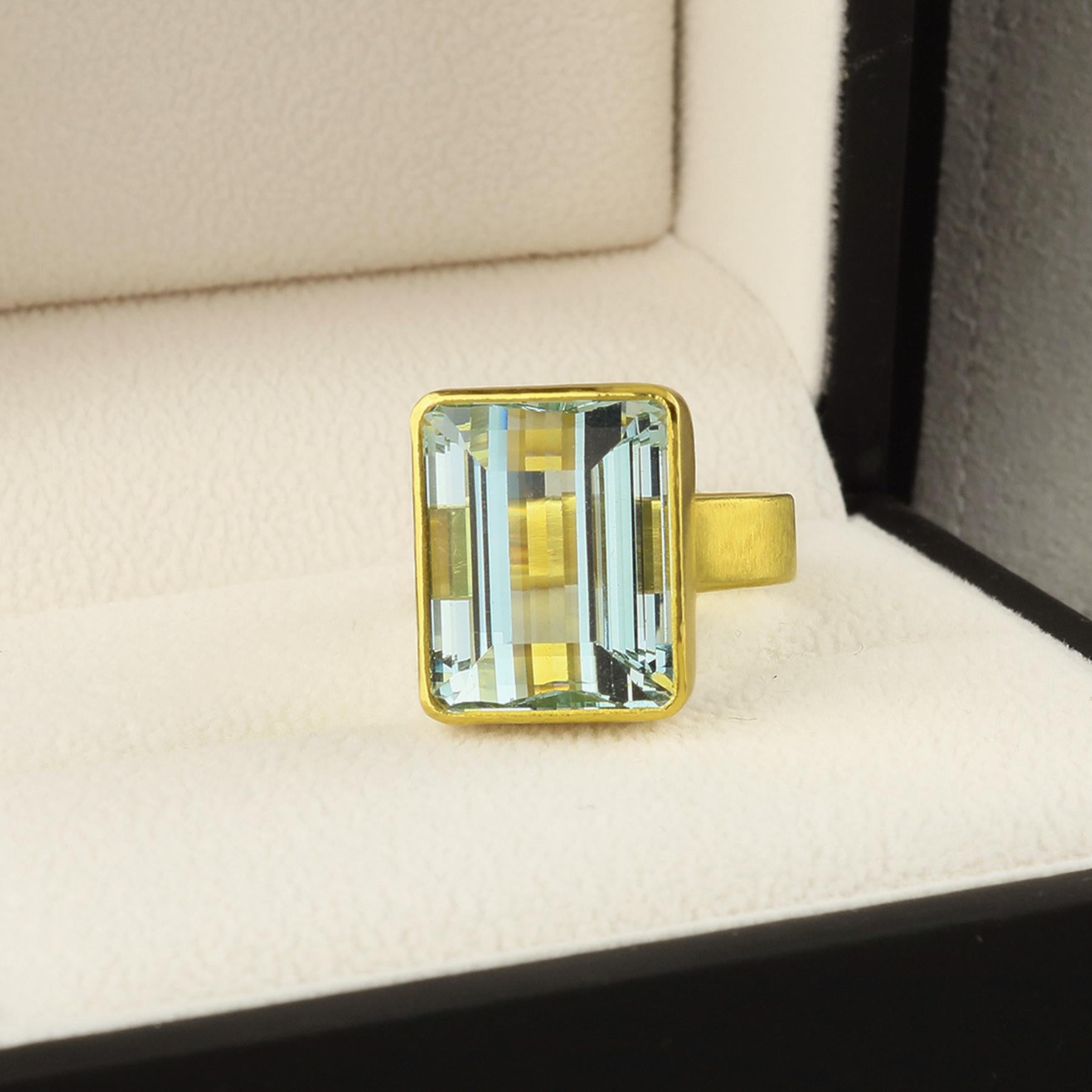 PHILIPPE SPENCER - Solid 20K Gold Completely Hand -Forged One-Of-A-Kind Wide-Band Statement Ring with 20.4 Ct. Extra-Fine Emerald Cut Aquamarine set in backless 22K Gold Setting. Heavy Matte Brushed Finish. The size is 7 3/4 to 8, and is in-stock