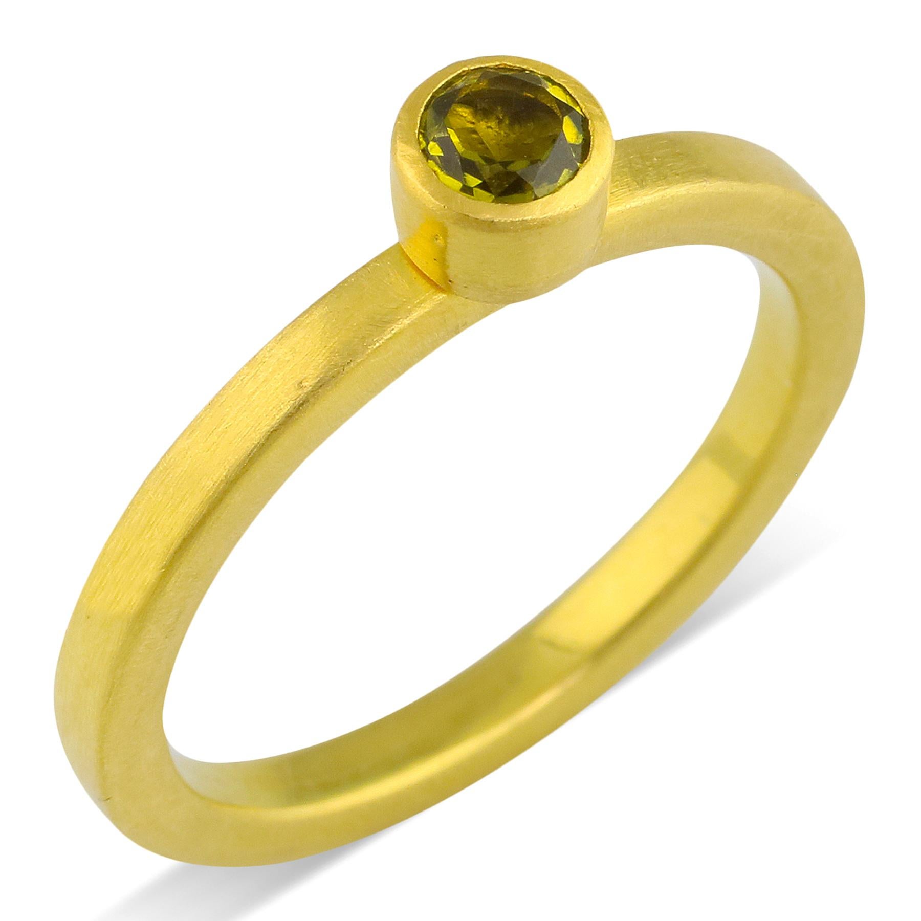 PHILIPPE-SPENCER -   .24 Ct. Faceted Olive Tourmaline wrapped in 22K Gold Bezel Setting, with Anvil-Forged Solid 20K Gold 2.25mm x 2mm Band. Heavy Brushed Exterior, Mirror Polish Interior.  Size 7, and is in-stock and ready to ship. Our apologies in