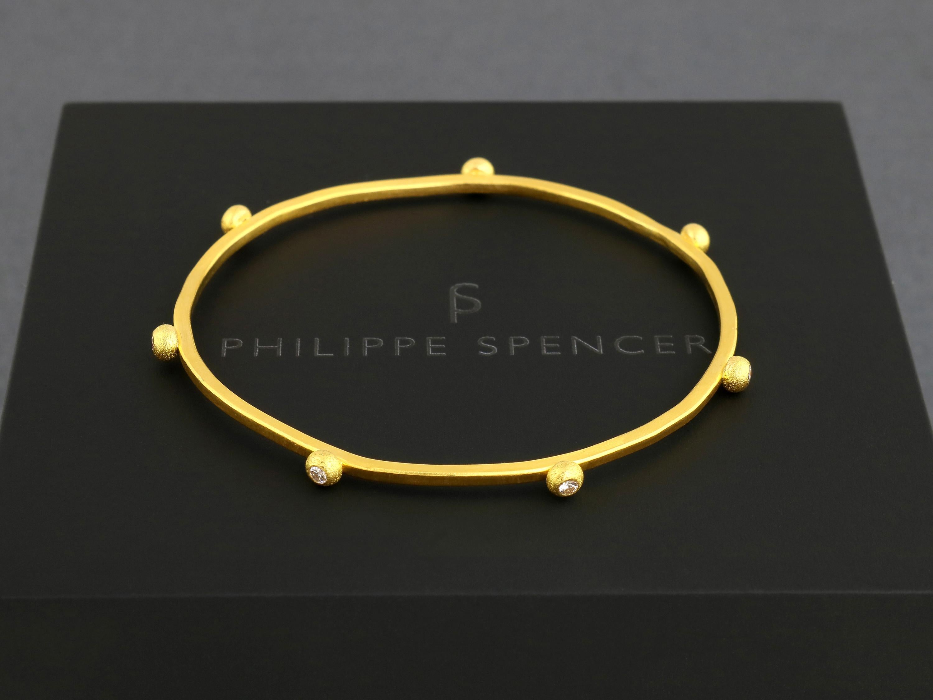 PHILIPPE SPENCER - Solid 24K Gold 2mm X 2mm Completely Hand & Anvil-Forged Bangle with 7-Quantity COLORLESS (D-F) Diamonds ( 1/3 Ct. Total) set in Pure 22K Gold Drops. A truly unique One-Of-A-Kind work of art.  

Being Pure 24 Karat Gold, it's