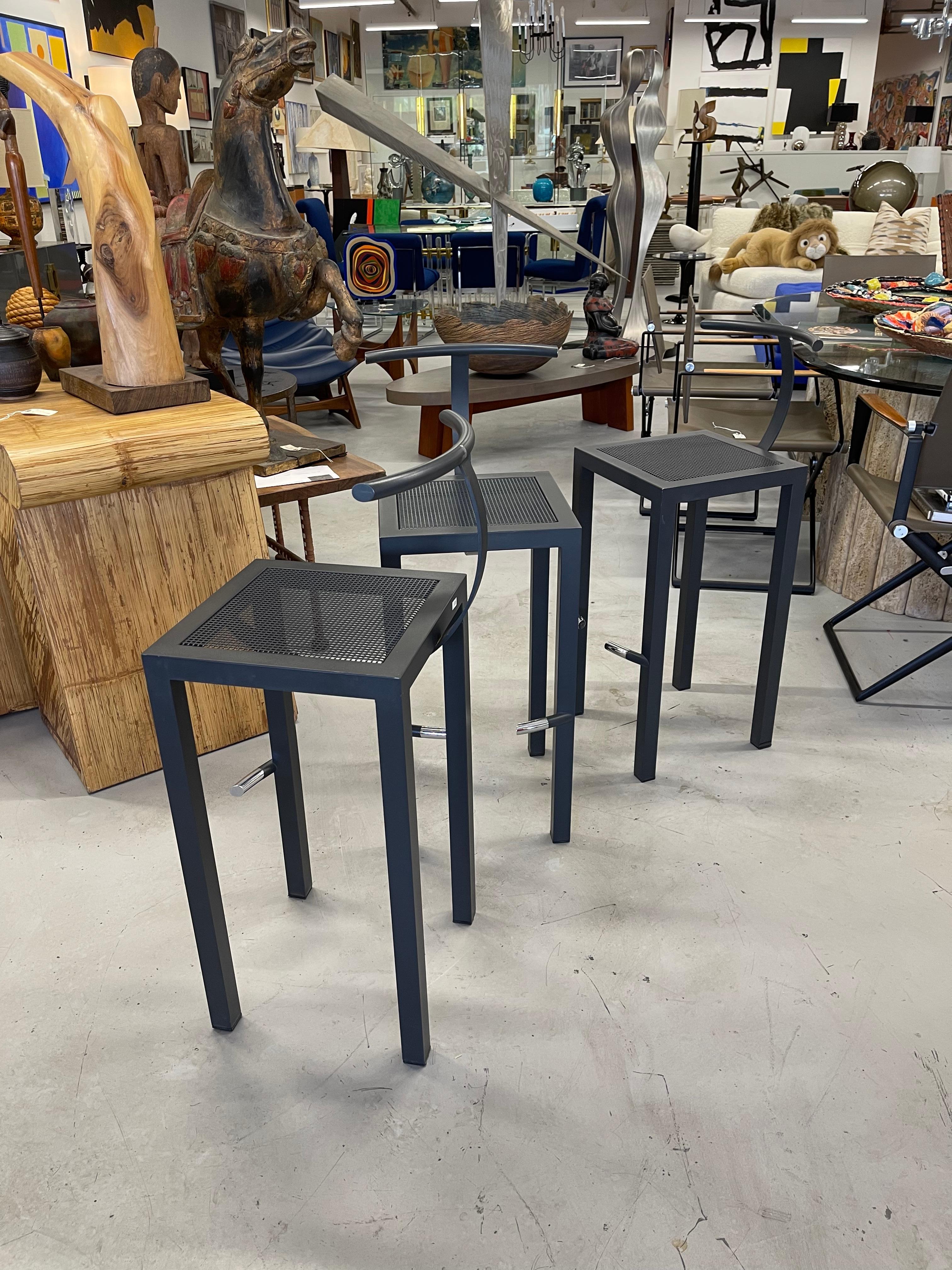 A set of 3 Driade steel Serapis stools designed Philippe Starck for his design firm Aleph Ubik. Good condition with minor imperfections. Measures: Seat height is counter height at 26.5 inches.