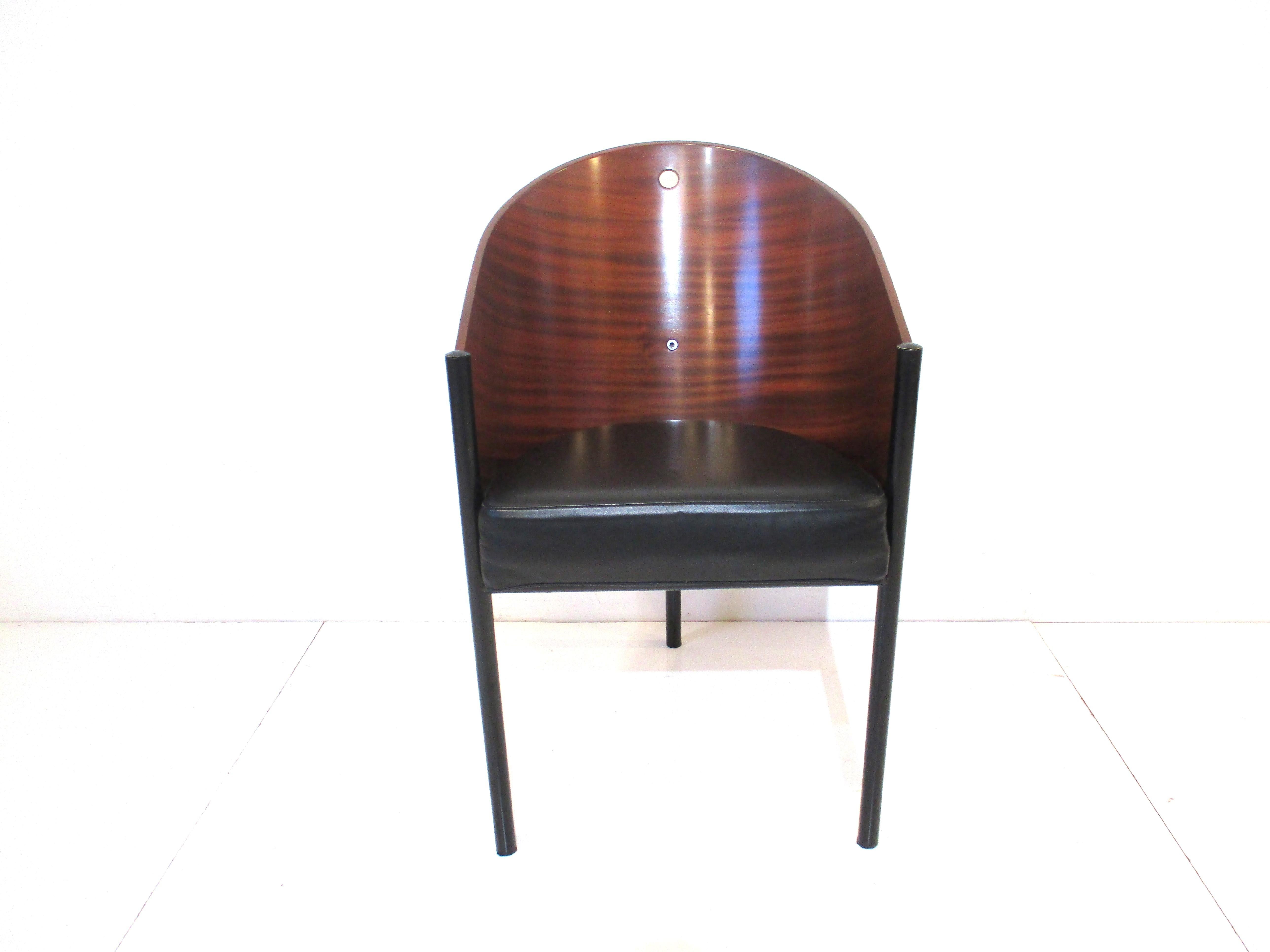 A very well crafted Costes chair by French designer Philippe Starck with rounded wood back and hole detail to the upper edge for pulling the chair into position . The satin black three legs and leather cushion make this chair comfortable yet