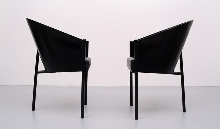 A set of four three-legged black chairs. Designed by Philippe Starck in 1982 for the Cafe Costes in Paris these chairs were produced by Aleph Ubik an French company in the 1980s. Chairs have a black metal tubular frame with black laminated plywood
