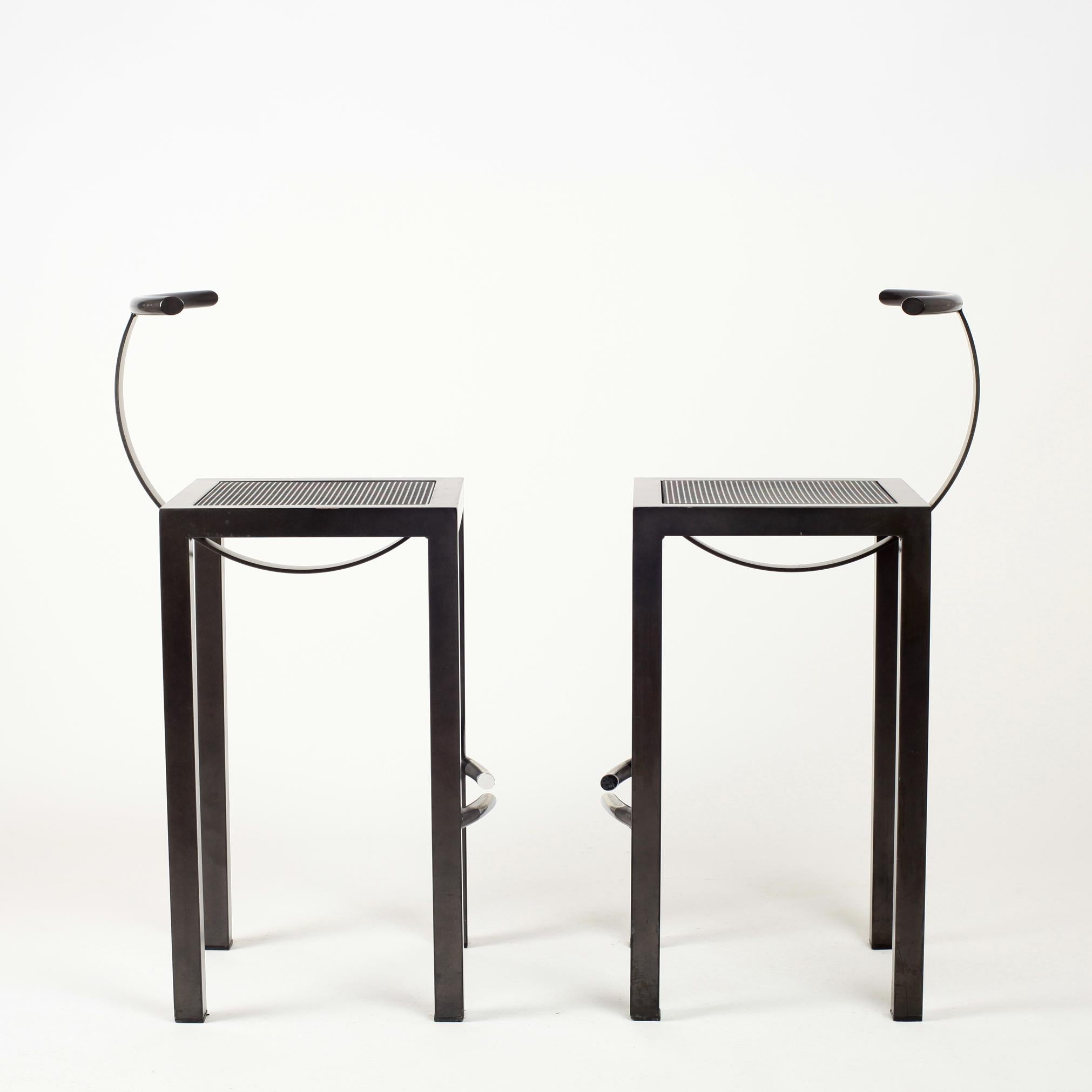 Philippe Sarck Sarapis barstools for Driade, 1986
Dark grey steel
No longer manufactured

Bibliography: Similar model reproduced in:
- Charlotte & Peter Fiell, 1000 chairs, Taschen Edition.