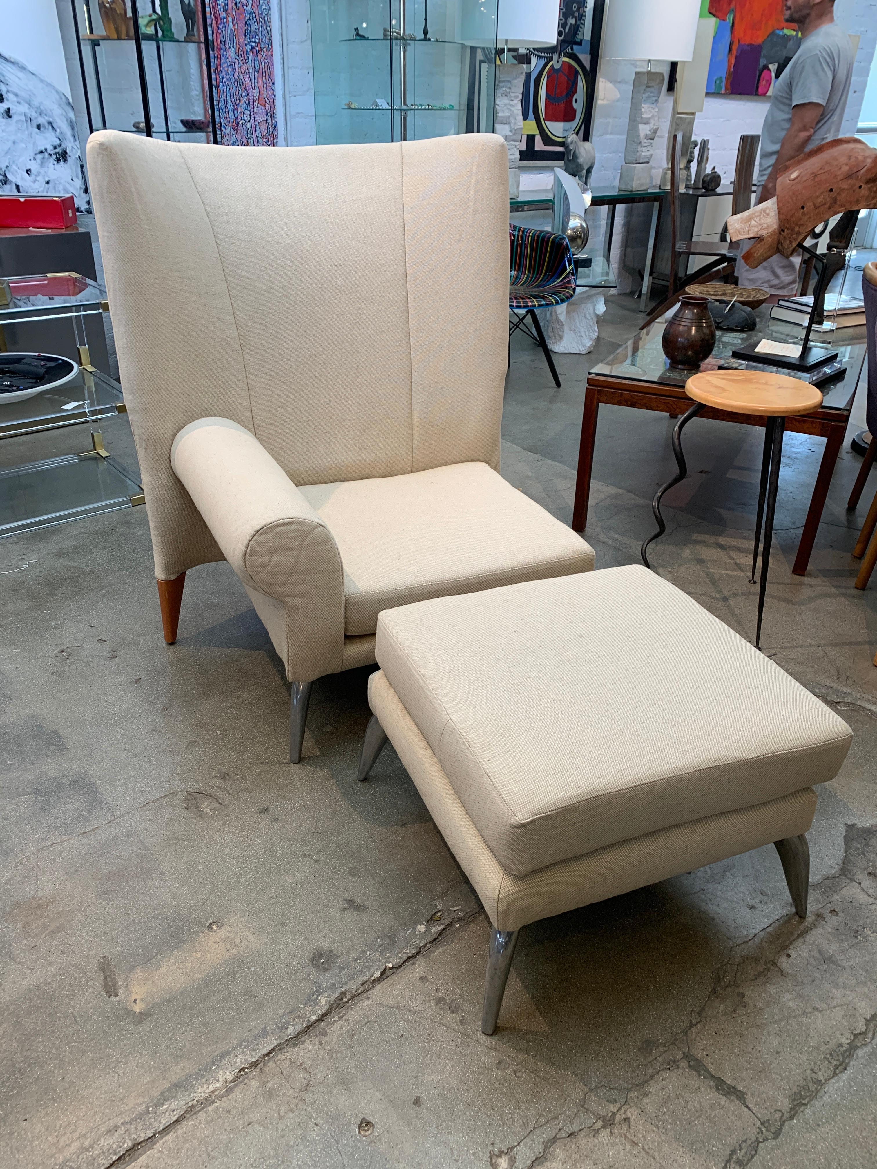 A Phillip Starck designed chair and ottoman from the Royalton hotel in New York City produced by Driade. These chairs were in the lobby of the iconic Ian Schrager hotel. These were re-upholstered in a linen fabric. The ottoman measures approx 23