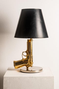 Philippe Starck pour Flos  Lampe de table en or "Bedside Gun", Italie, années 2000