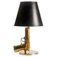 Philippe Starck for Flos  “Bedside Gun” Gold Table Lamp, Italy, 2000s