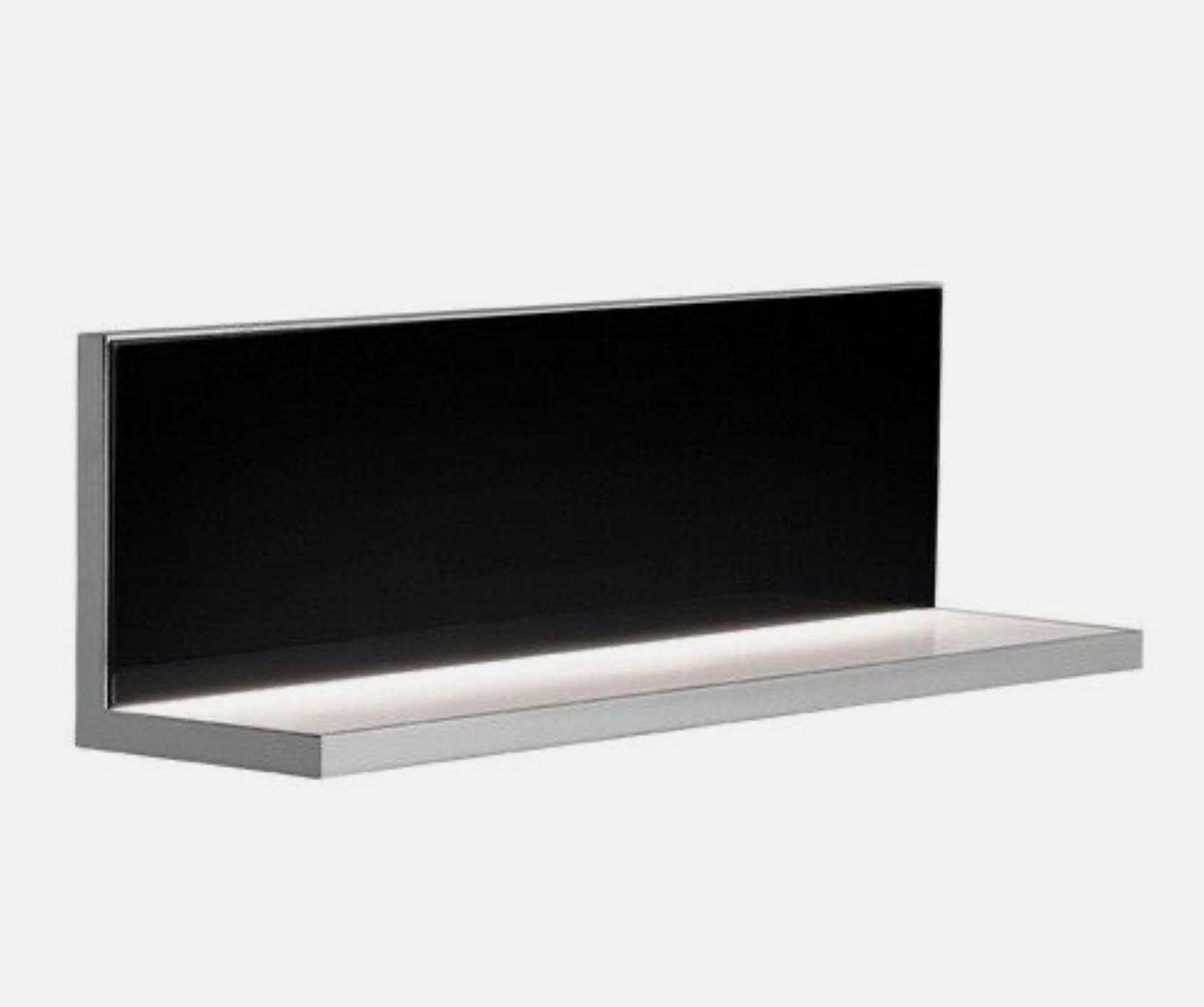 The Flos Hide wall lamp by Flos Lighting is a modern LED wall flusher that functions as a shelf as well. Indirect-light wall lamp. Body in pressofused aluminium, with shiny finish. Injection printed diffuser in photo engraved PMMA.
Lighting is by