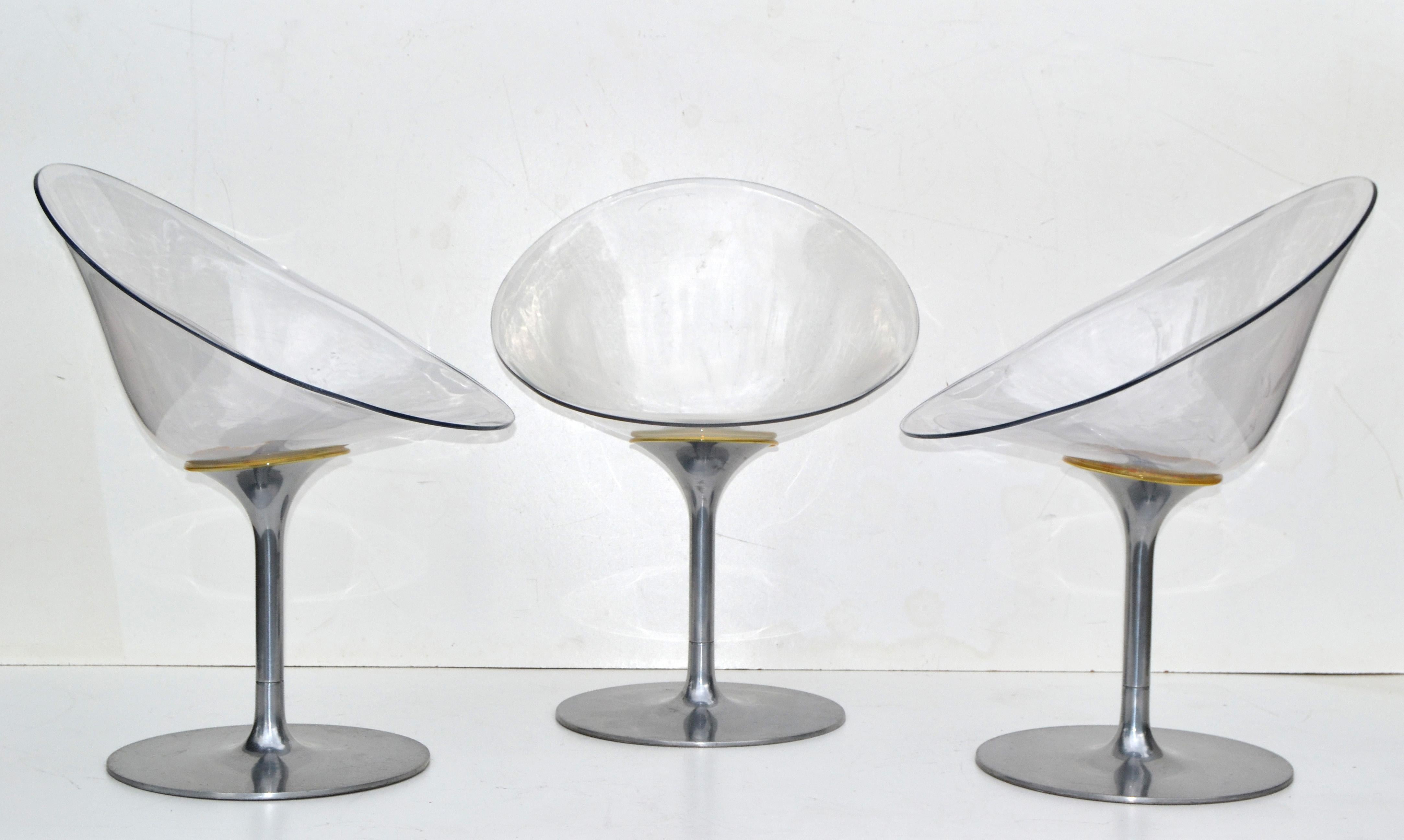 Set of 3 transparent Lucite Eros swivel chairs designed by Philippe Starck for Kartell and made in Italy.
The seat is made out of acrylic and the base is aluminum.
Marked at the seat.
The swivel function works smoothly.