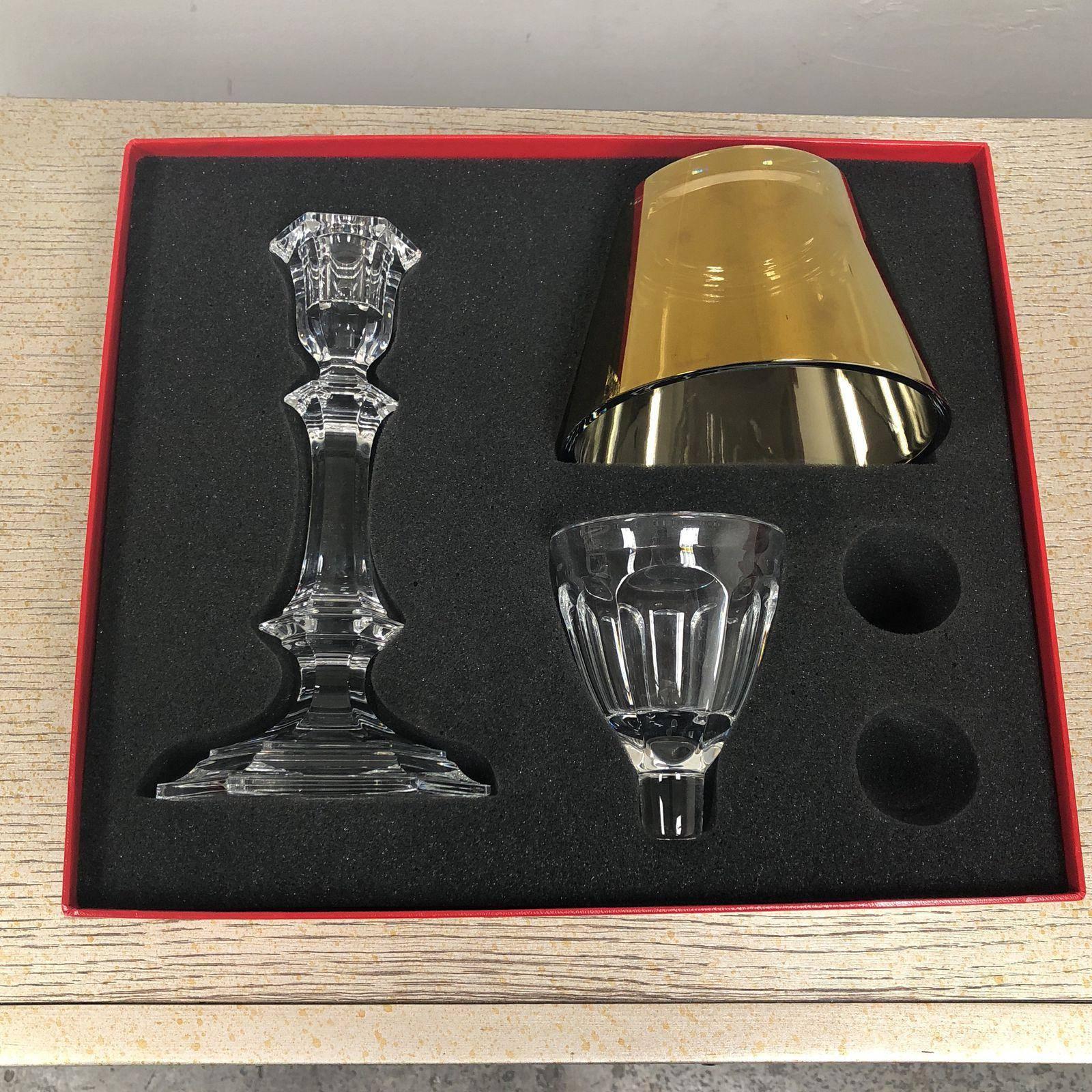 A Harcourt our fire baccarat crystal designed by Phillipe Starck.
A stunning piece to enrich your home, signed and numbered. This is part of the Darkside collection. A crystal base with a gold shade. Handmade in France.
    
