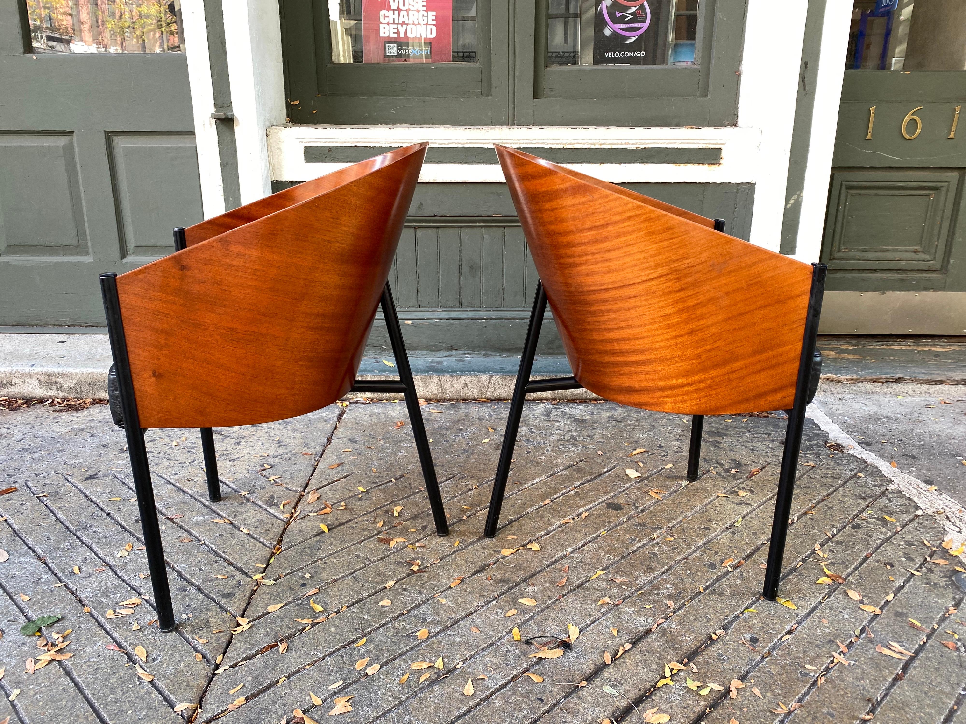 Pair of Philippe Starck King Coste pair of mahogany barrel chairs produced by Driade Aleph . 3 legged metal frame supports a curved back of Mahogany with black leather seats. Overall very nice shape, a little edge wear as seen in photos and one