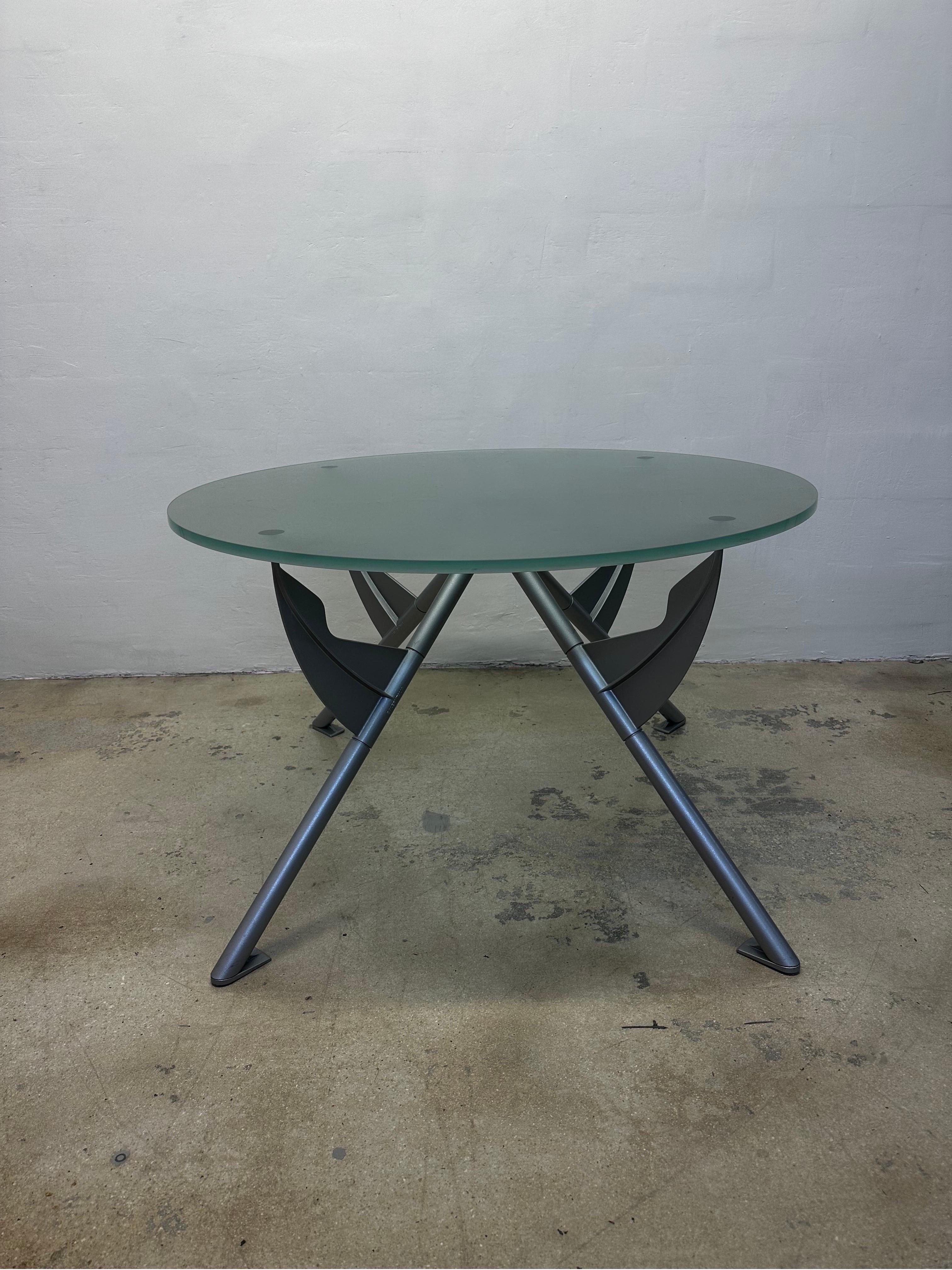 President M dining or center table with sandblasted seafoam green glass top on a gray enameled steel base by Philippe Starck for Baleri Italia.