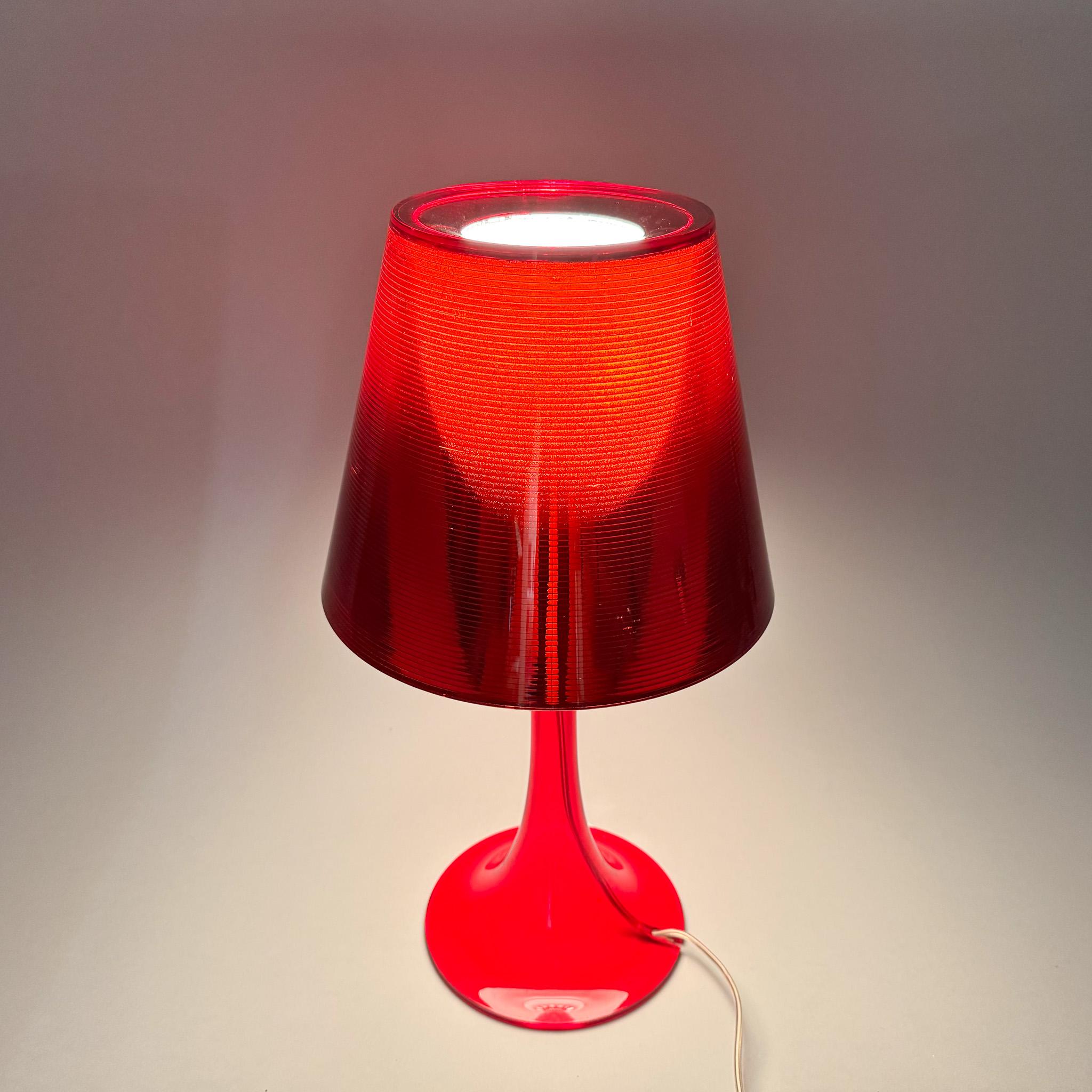 Red table lamp designed by Philippe Starck for FLOS in Italy in the 2000's. US adapter included.